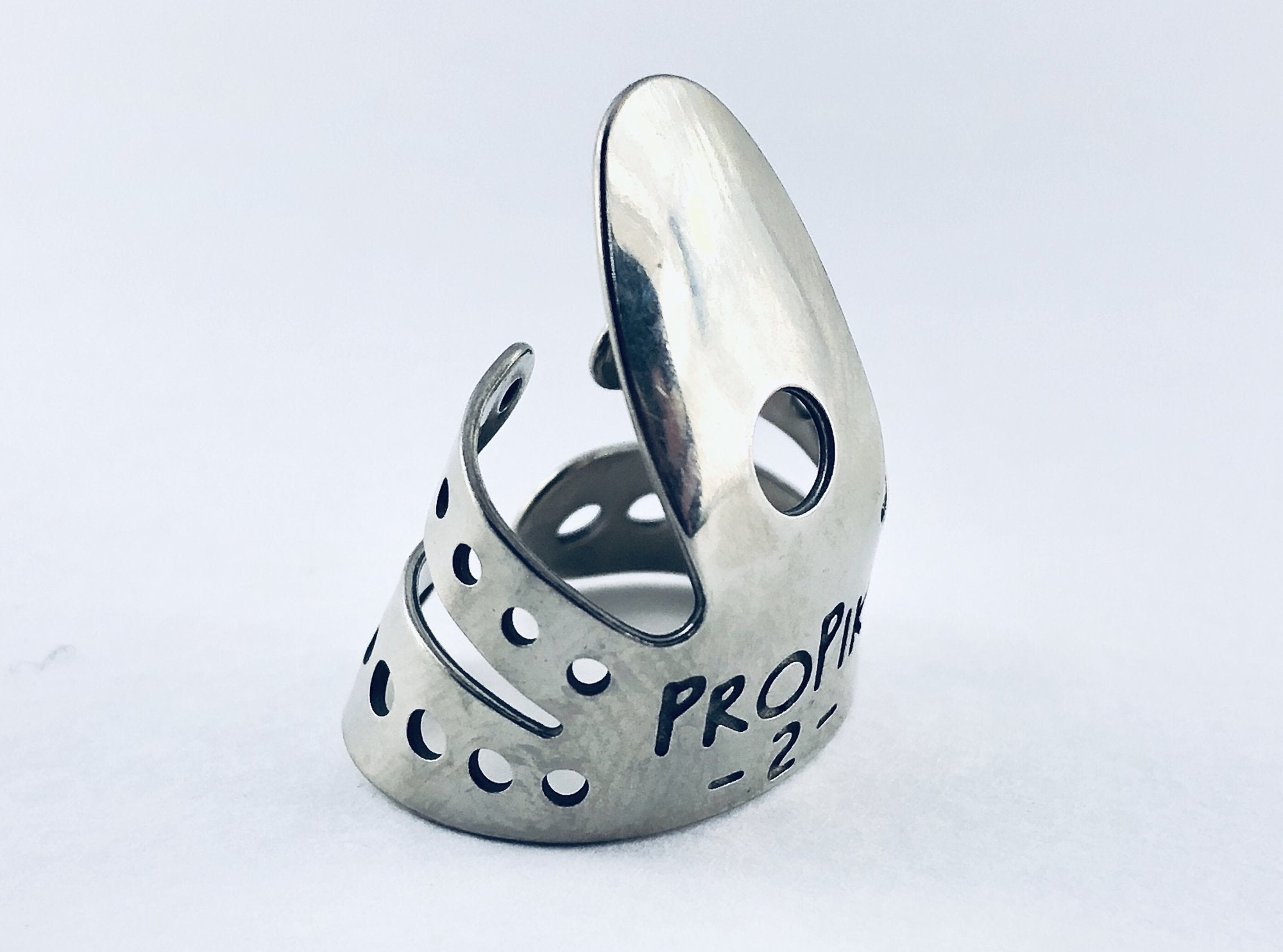 A pair of ProPik Extra Comfortable Nickel Split Wrap #2 Finger Picks (11-201-1322), with a shiny metal finish and multiple holes, stand upright against a plain white background. Brand: ProPik.