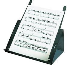 The Acoustic Shoppe’s 2140 Prop-it Music Stand in black displays a sheet of musical notation at an angle on a white background.