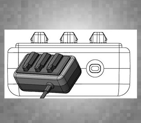 A black and white illustration of the ToneRite Guitar by The Acoustic Shoppe, shown at an angle with vintage instrument vibes, three buttons, a directional pad, and a connected cable.