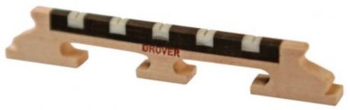 The Grover 9 1/2 Inch Five String Banjo Bridge, by Grover, is a quality accessory designed to securely hold strings in place on five-string banjos.