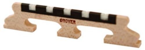 A close-up of a Grover guitar nut and a Grover 96 Five String Banjo Bridge with 5/8 inch high insert, both featuring precision slots to securely hold strings on the headstock.