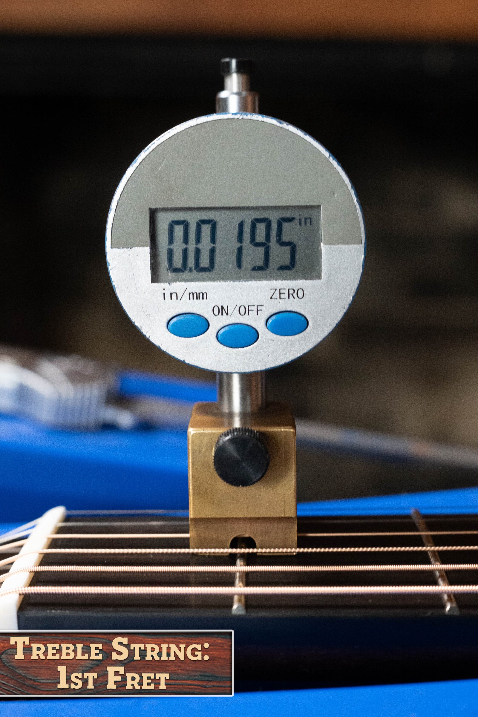 A digital gauge reads 0.195 inches above the first fret of a Bedell Angelica Bellissima Parlor Guitar’s treble string. A blue background and a corner label show: Treble String: 1st Fret. Brand: Bedell Guitars.