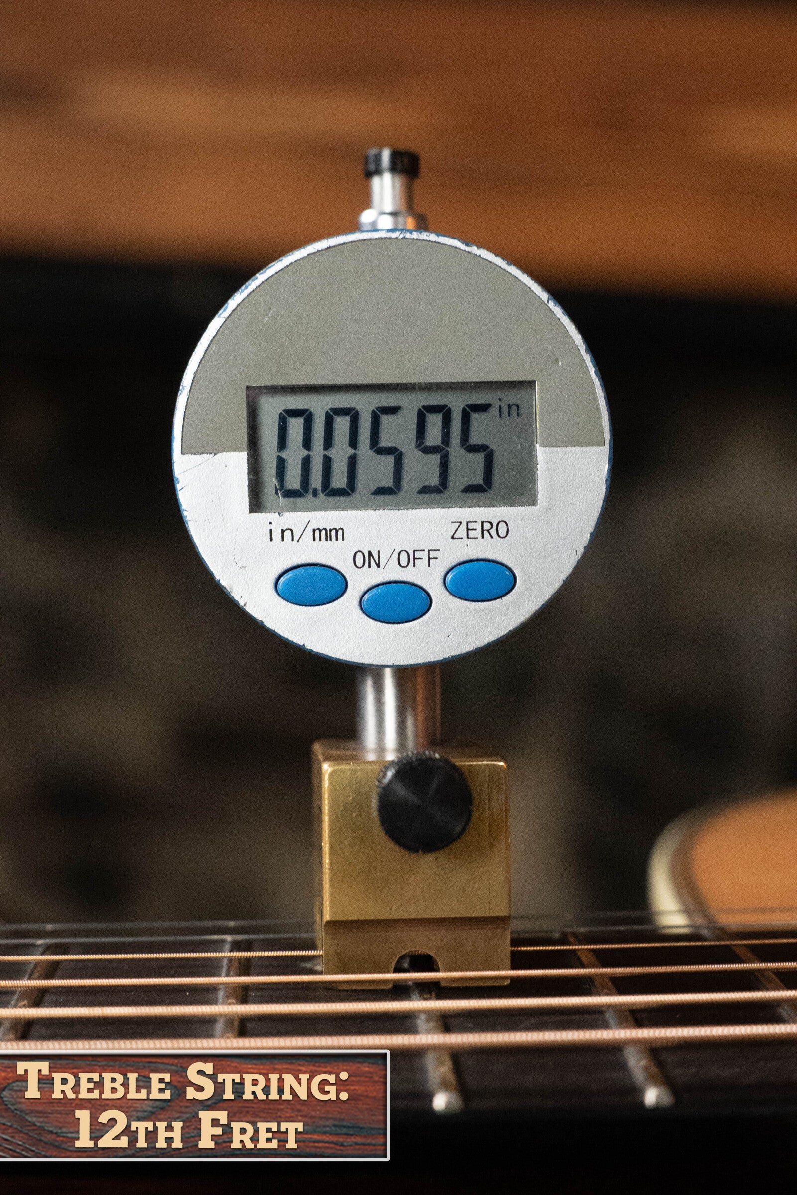 A digital gauge shows 0.0595 inches measuring the treble string height at the 12th fret on a Bourgeois D Vintage/TS Touchstone Series Dreadnought Acoustic Guitar #7014. A label reads, "Treble String: 12th Fret.