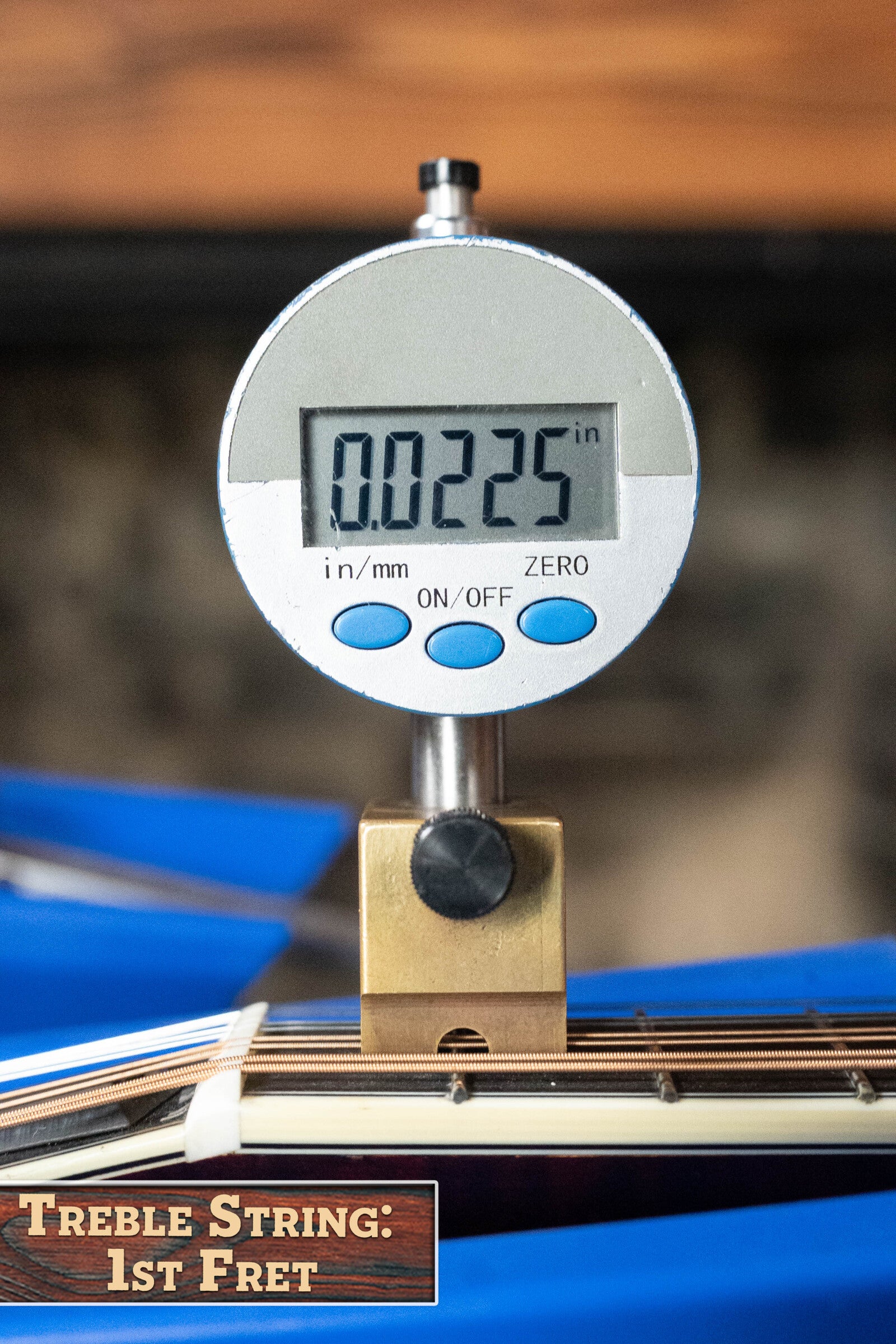 A digital gauge reads 0.0225 for the string height at the first fret of a Bourgeois M5-A-BT Aged-Tone Black Top A-Style Mandolin #2020. The label in the bottom left says: Treble String: 1st Fret.