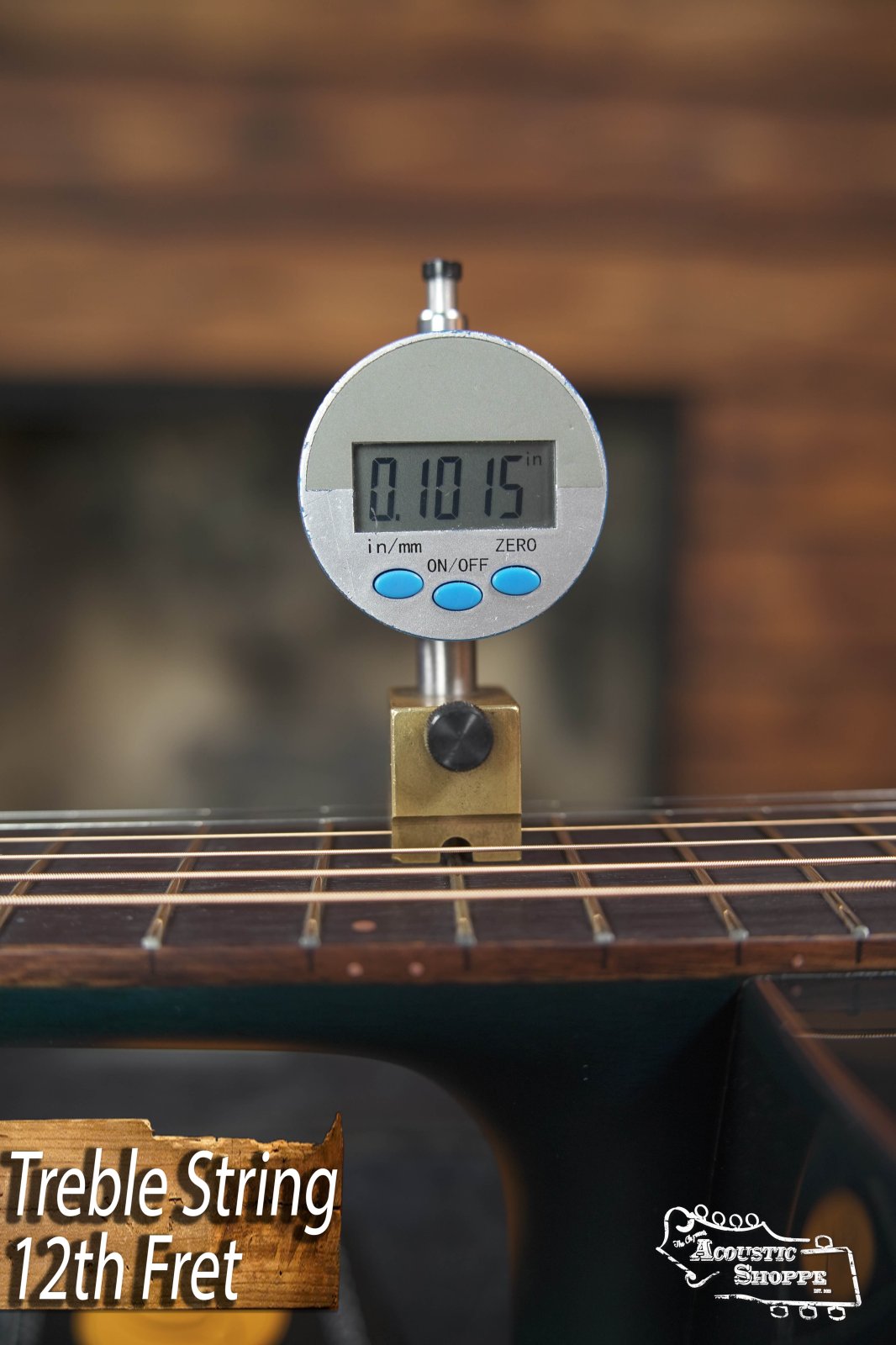 A digital gauge shows a 0.1015-inch string height above the 12th fret of a Breedlove Rainforest S Concert Papillon All Mahogany Cutaway Acoustic Guitar w/Fishman Pickup #6534. Label: Treble String 12th Fret; Acoustic Shoppe logo visible.