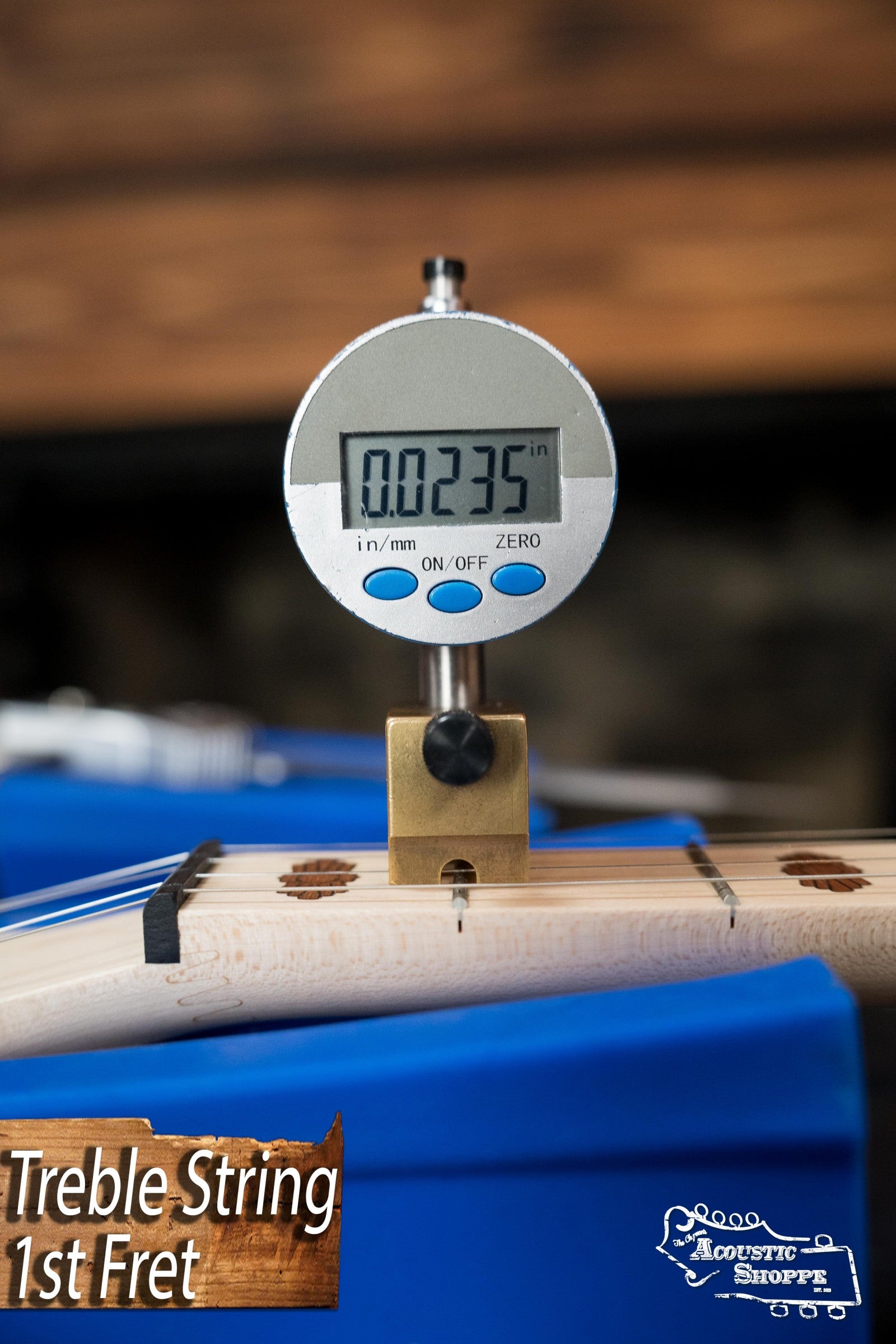 A digital caliper shows 0.0235 inches for the treble string height at the 1st fret. “Treble String 1st Fret” and “Acoustic Shoppe” logos appear, similar to setups for a Deering Goodtime Deco 5-String Banjo #62407 by Deering Banjos.