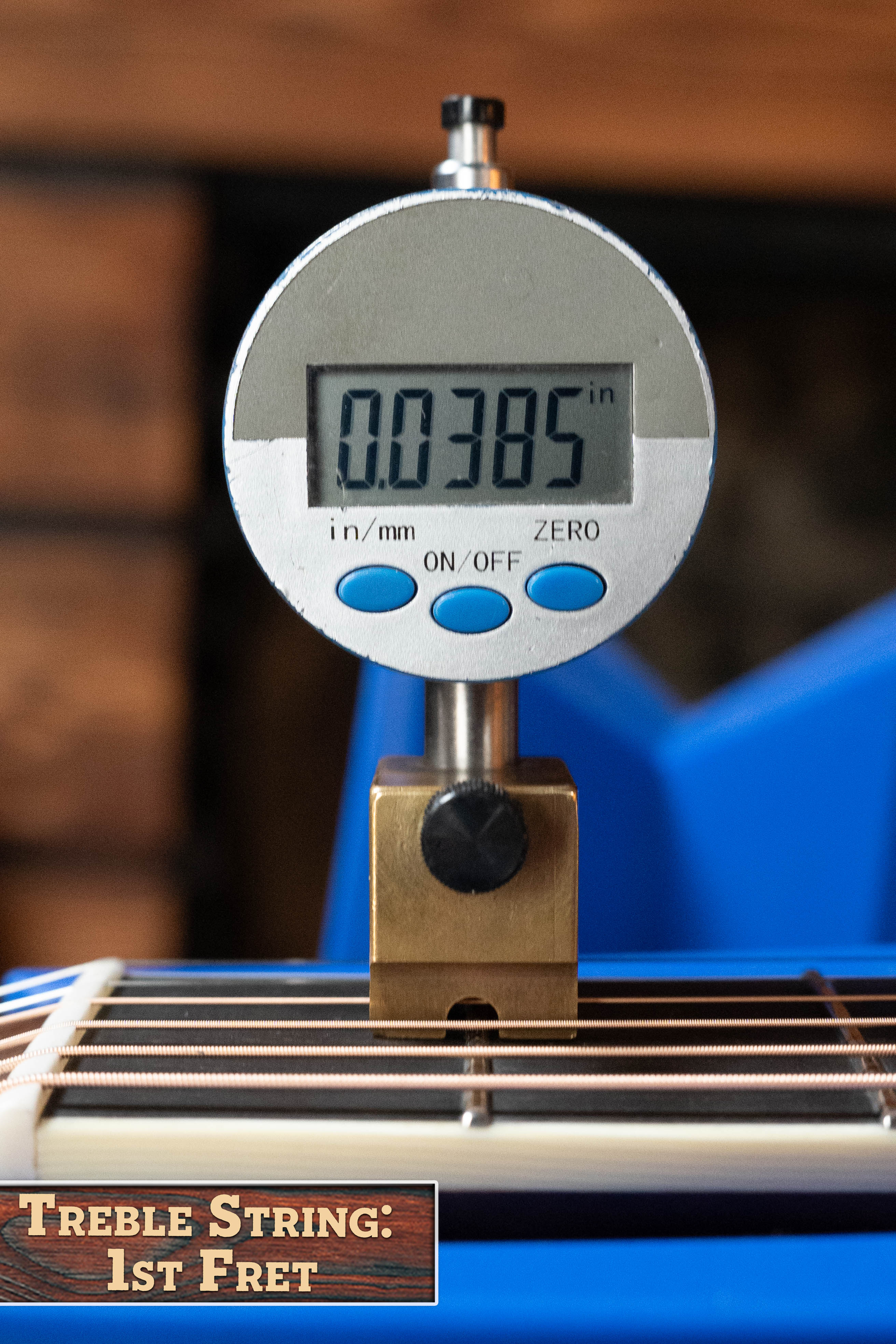 A digital gauge shows 0.0385 inches for the treble string height at the first fret, with "Treble String: 1st Fret" in the lower-left corner, measured on an Eastman Guitars E20D-LSH-TC #3917 acoustic guitar.