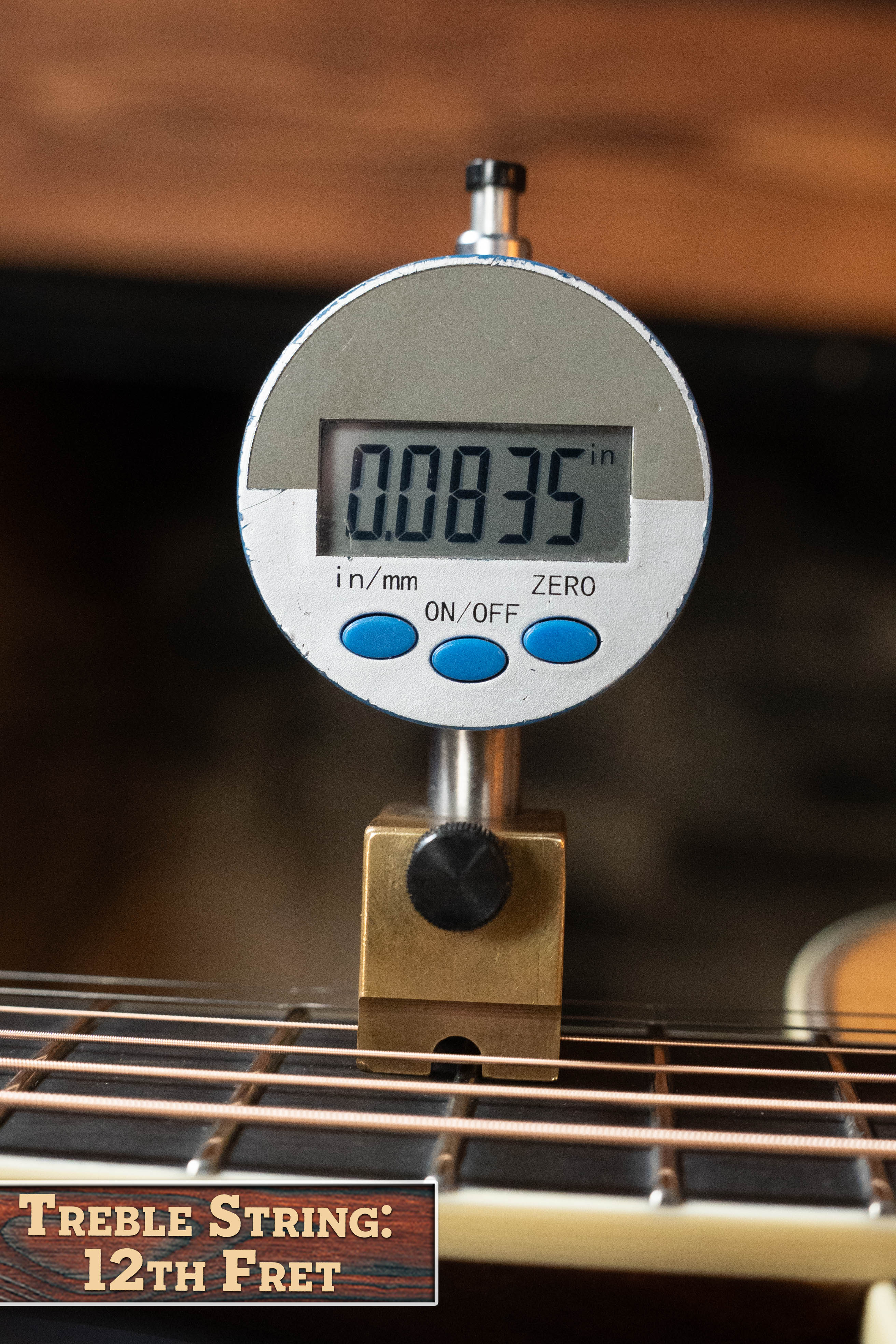 A digital gauge shows a string height of 0.0835 inches at the 12th fret on an Eastman Guitars E20D-LSH-TC Thermo-Cured Adirondack/Rosewood Large Soundhole Dreadnought Acoustic Guitar #3917, labeled “Treble String: 12th Fret.”.