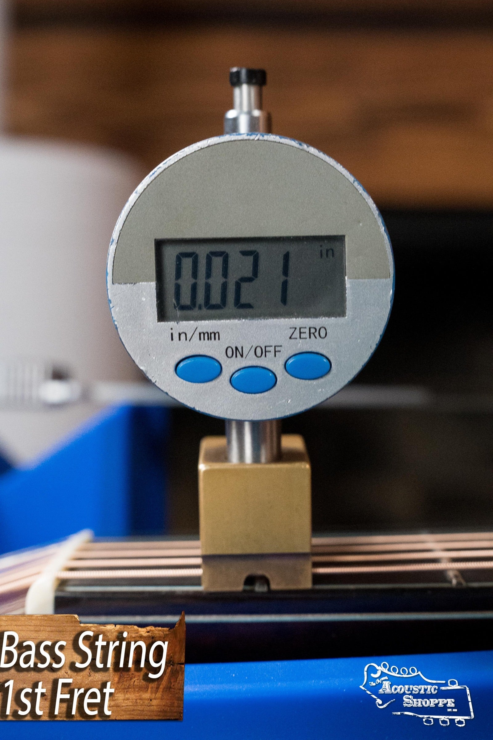 Digital gauge measuring 0.021 inch on bass guitar string over fretboard. - Eastman AC722CE-DF European Spruce/Rosewood Dakota Fade Finish Grand Auditorium w/ LR Baggs Pickup #6872 - Default Title