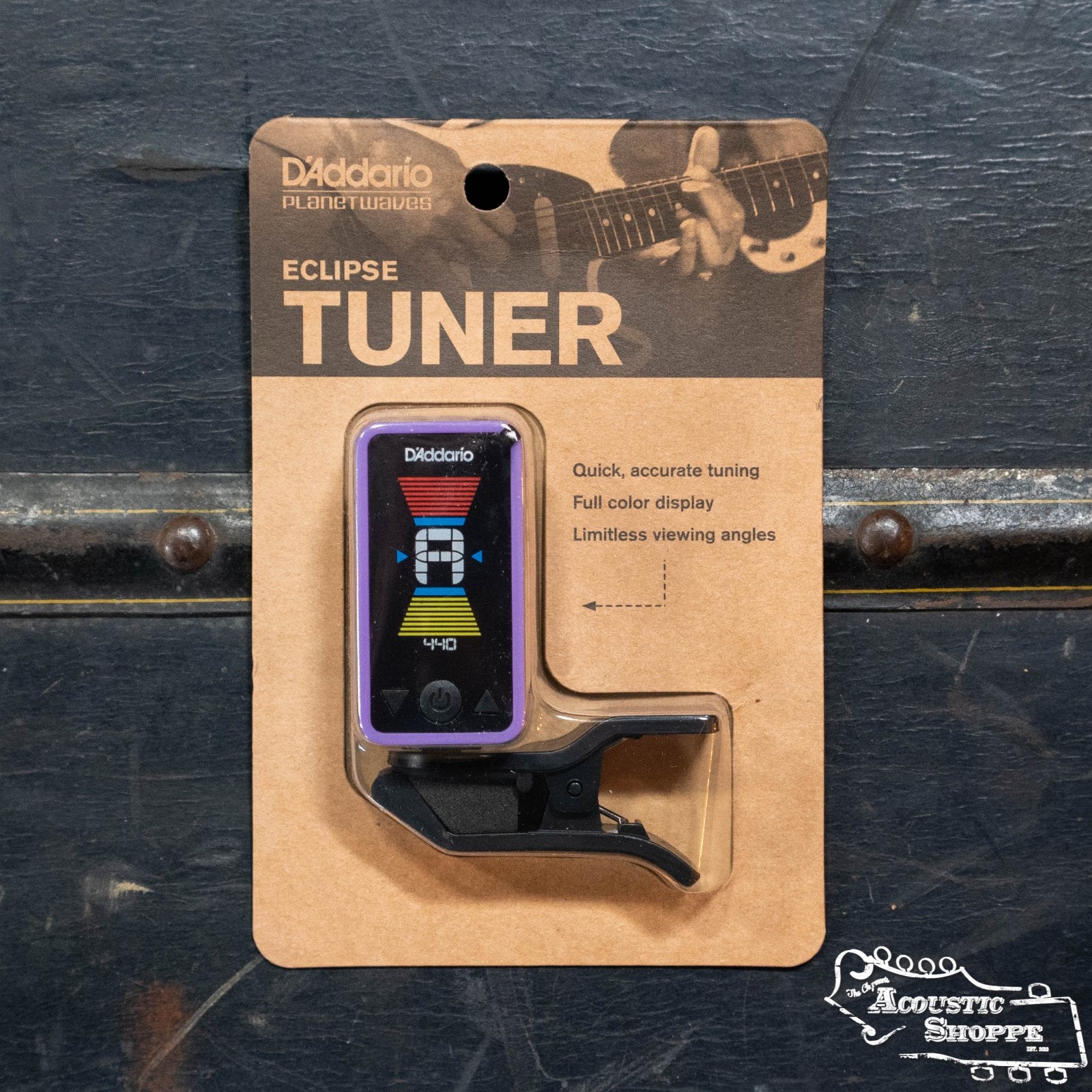 The D'Addario Eclipse Headstock Tuner is shown in its packaging against a dark background, featuring accurate and quick chromatic tuning, a full-color display, and an image of a guitar headstock.