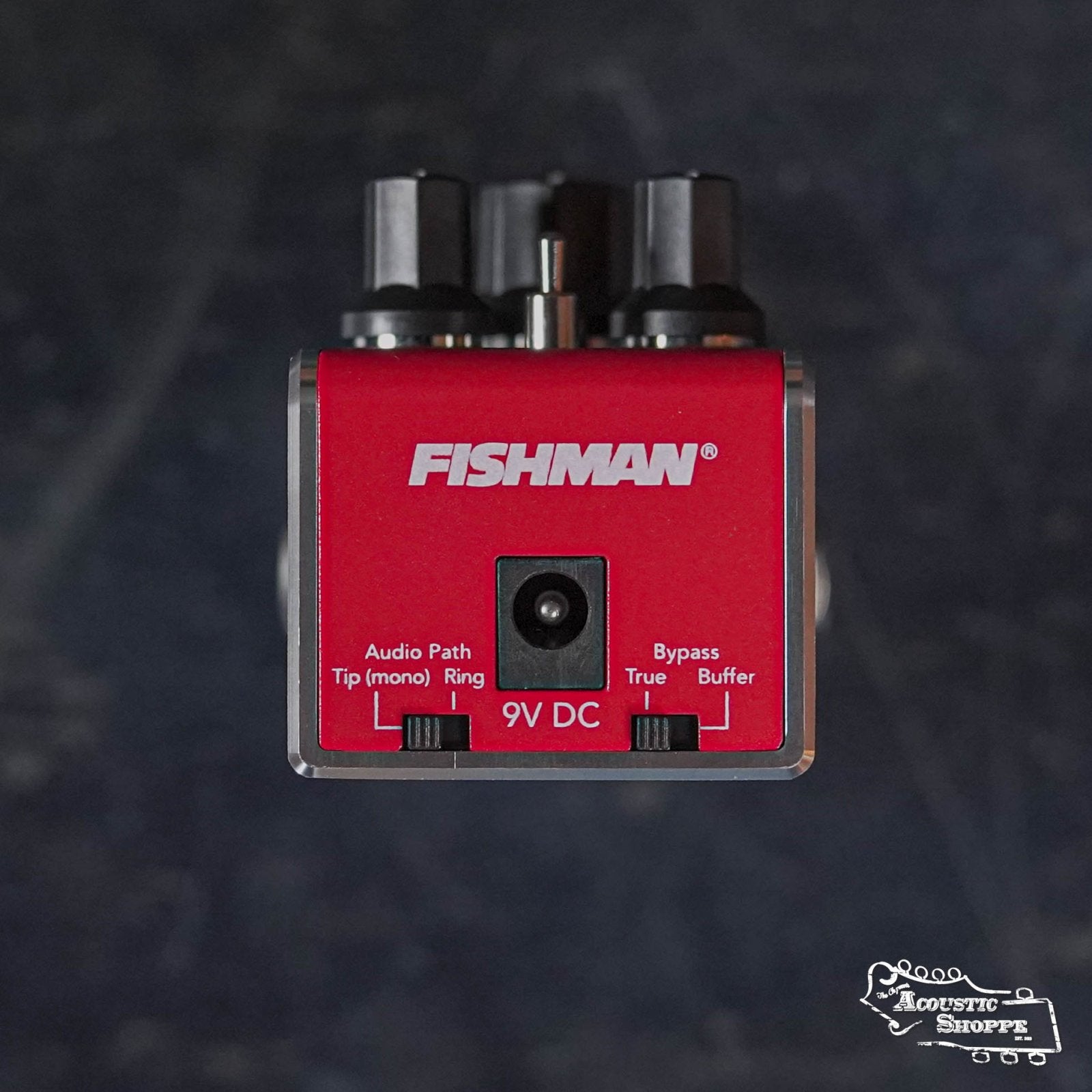 The Fishman AFX AcoustiVerb Mini Reverb Pedal PRO-AFX-RV2 is a red acoustic reverb pedal with true bypass, top-mounted input/output jacks, a 9V DC power input, and The Acoustic Shoppe logo in the bottom right corner.