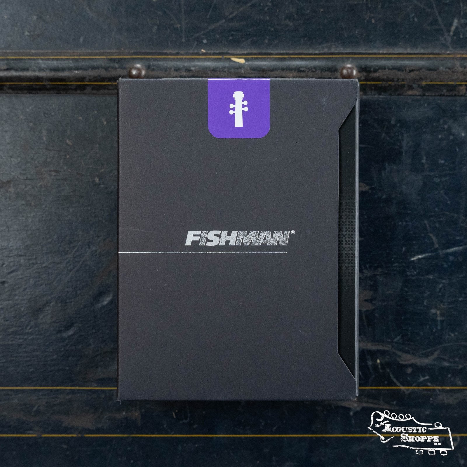 A black Fishman box with a silver logo, purple upright bass headstock icon on top, and Acoustic Shoppe logo bottom right, hints at premium upright bass sound—Fishman Full Circle Upright Bass Pickup (PRO-FCL-001).