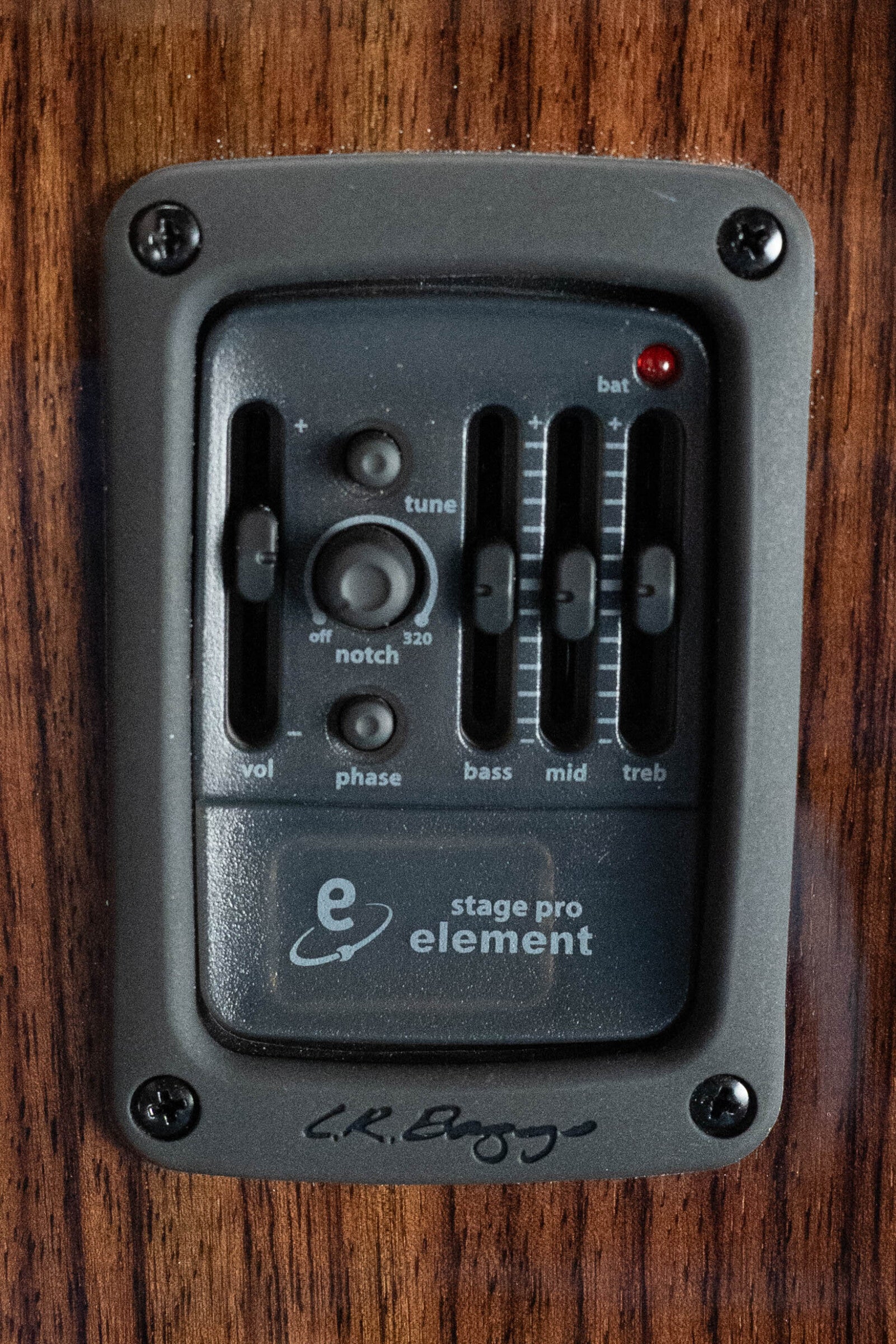 Close-up of the Furch Masters Choice Green SB Dc-SR AA Sitka/AA Indian Rosewood Dreadnought Sunburst Guitars preamp panel with knobs for volume, phase, tune, notch, bass, mid, treble, battery indicator & LR Baggs pickup.