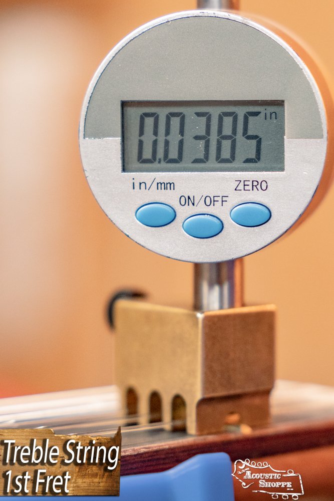 A digital gauge shows 0.0385 inches above the 1st fret of a Cordoba C3M Red Cedar/Mahogany Classical Guitar #8691’s treble string. “Treble String 1st Fret” text appears in the corner beside the Cordoba logo.