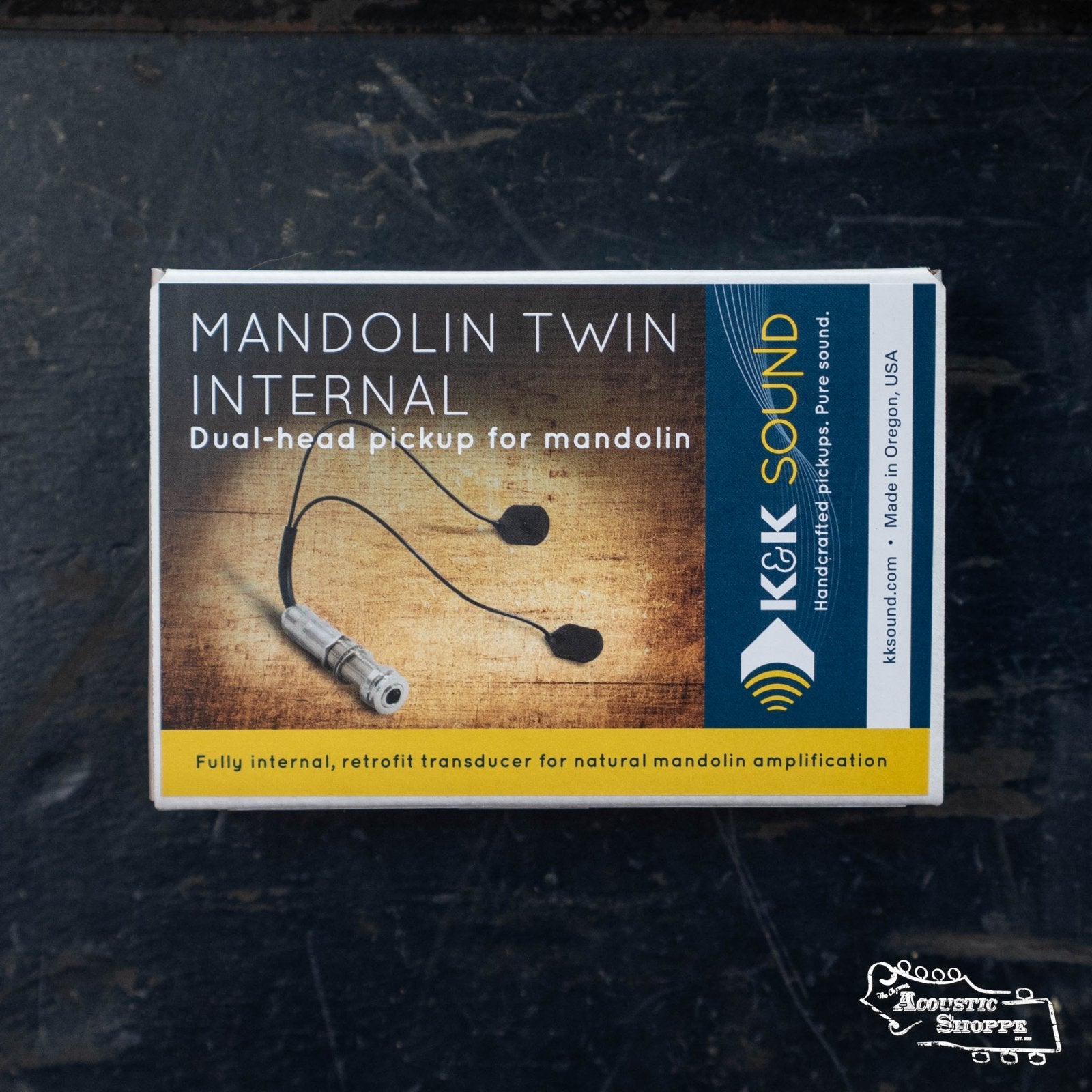 A box labeled K&K Mandolin Twin Internal Pickup by K&K Sound, displaying the internal pickup device for mandolin and text describing it as a natural amplification transducer.