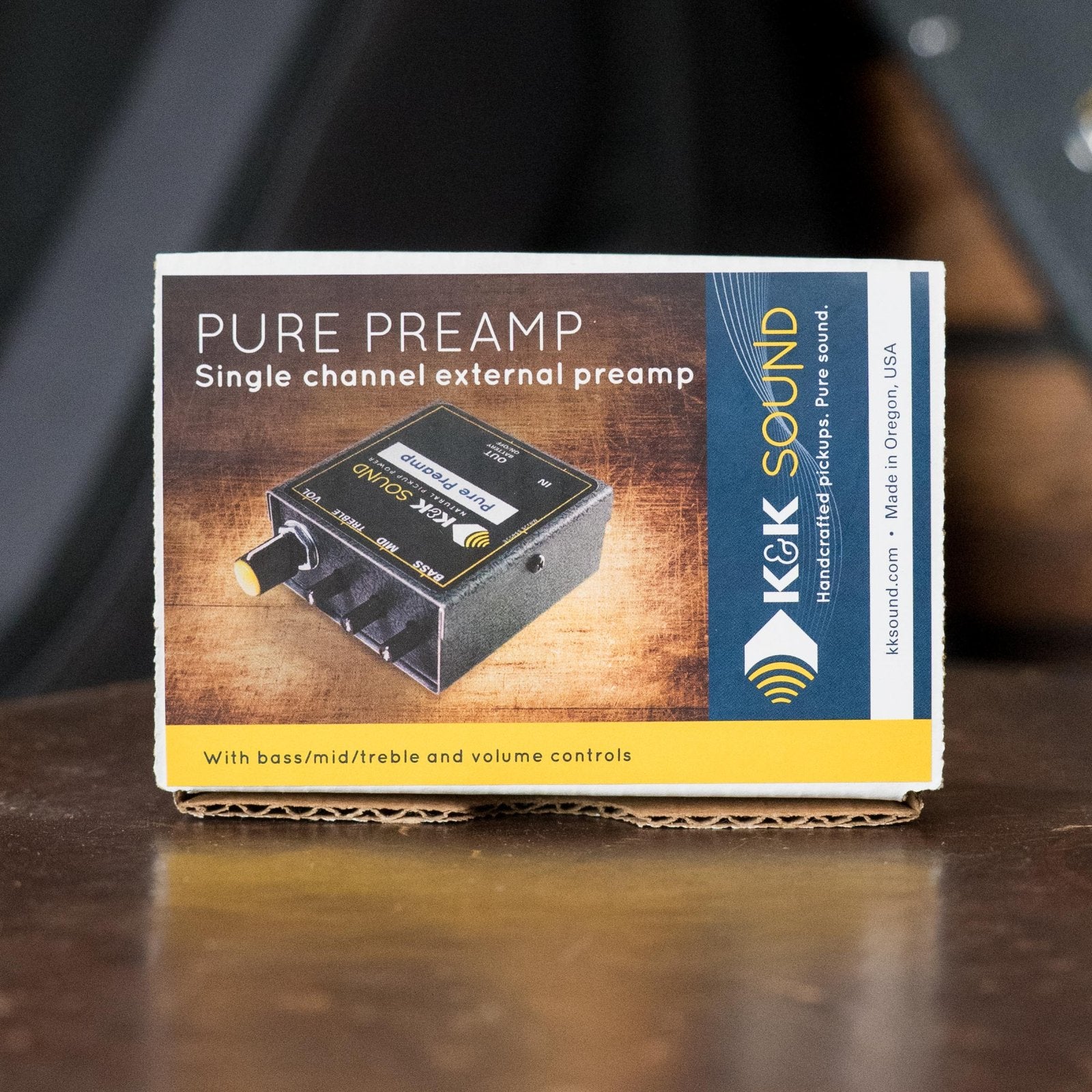 A K&K Sound Pure Preamp box is shown, highlighting the K&K Pure Preamp—an acoustic guitar preamp with a single channel and EQ controls for bass, mid, treble, and volume.