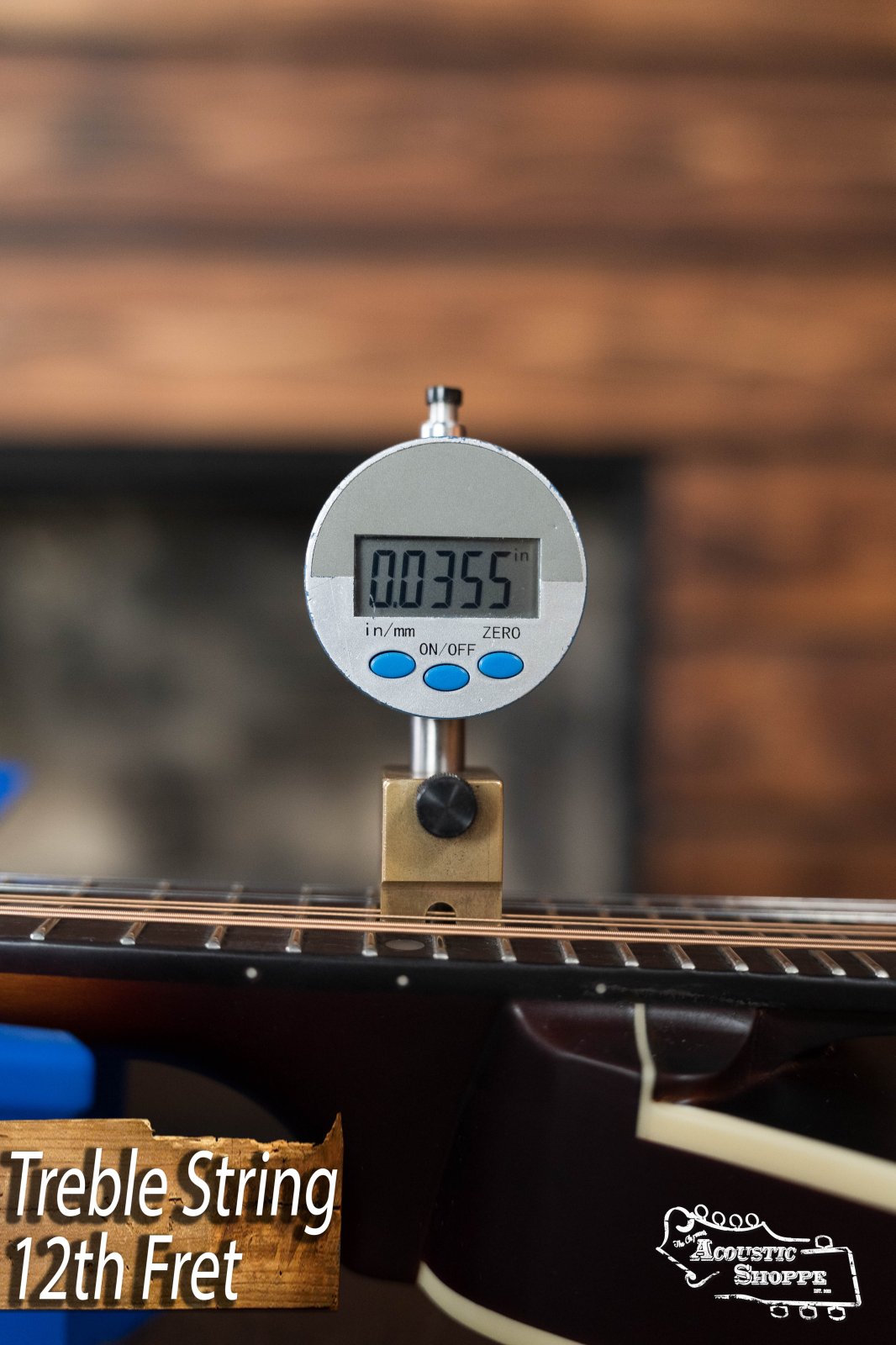 A digital gauge shows the string action at the 12th fret as 0.0355 inches, labeled "Treble String 12th Fret," with The Loar LM-110E-BRB "Honey Creek" A-Style Brownburst Mandolin and Acoustic Shoppe logos in the lower right corner.