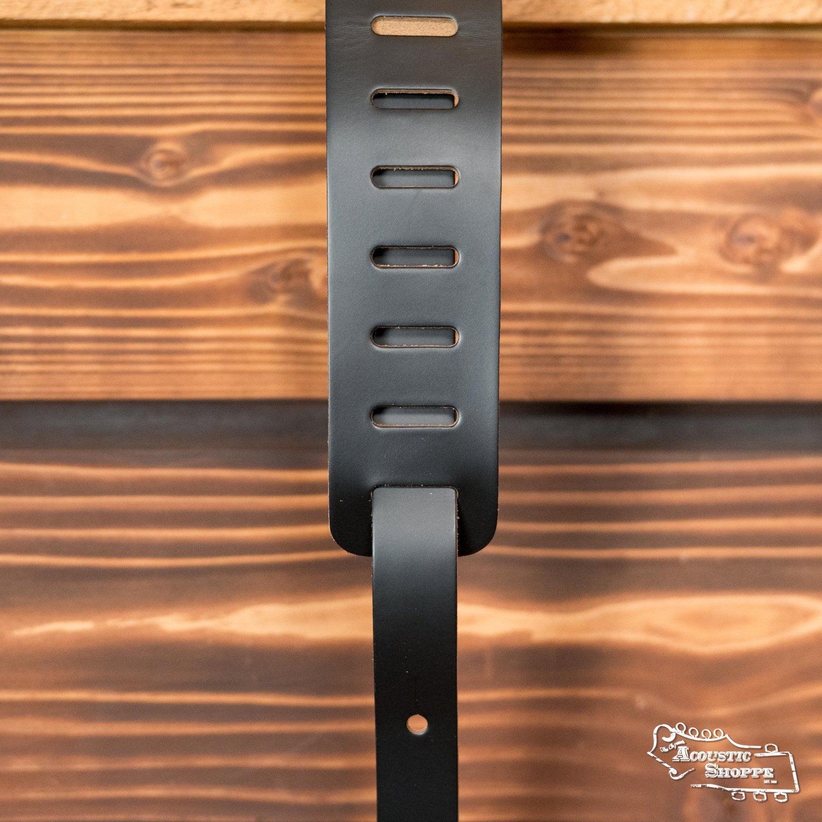 Black genuine leather guitar strap with multiple adjustment slots and polished finish. - Levy's Genuine Leather Guitar Strap M26-BLK - Default Title