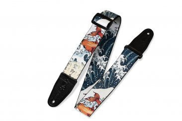 Levy's Leather Polyester Guitar Strap (MPD2-016) features a vibrant Japanese-inspired design with ocean waves and koi fish, black leather ends, and a Schaller Strap Lock System, shown on a white background.