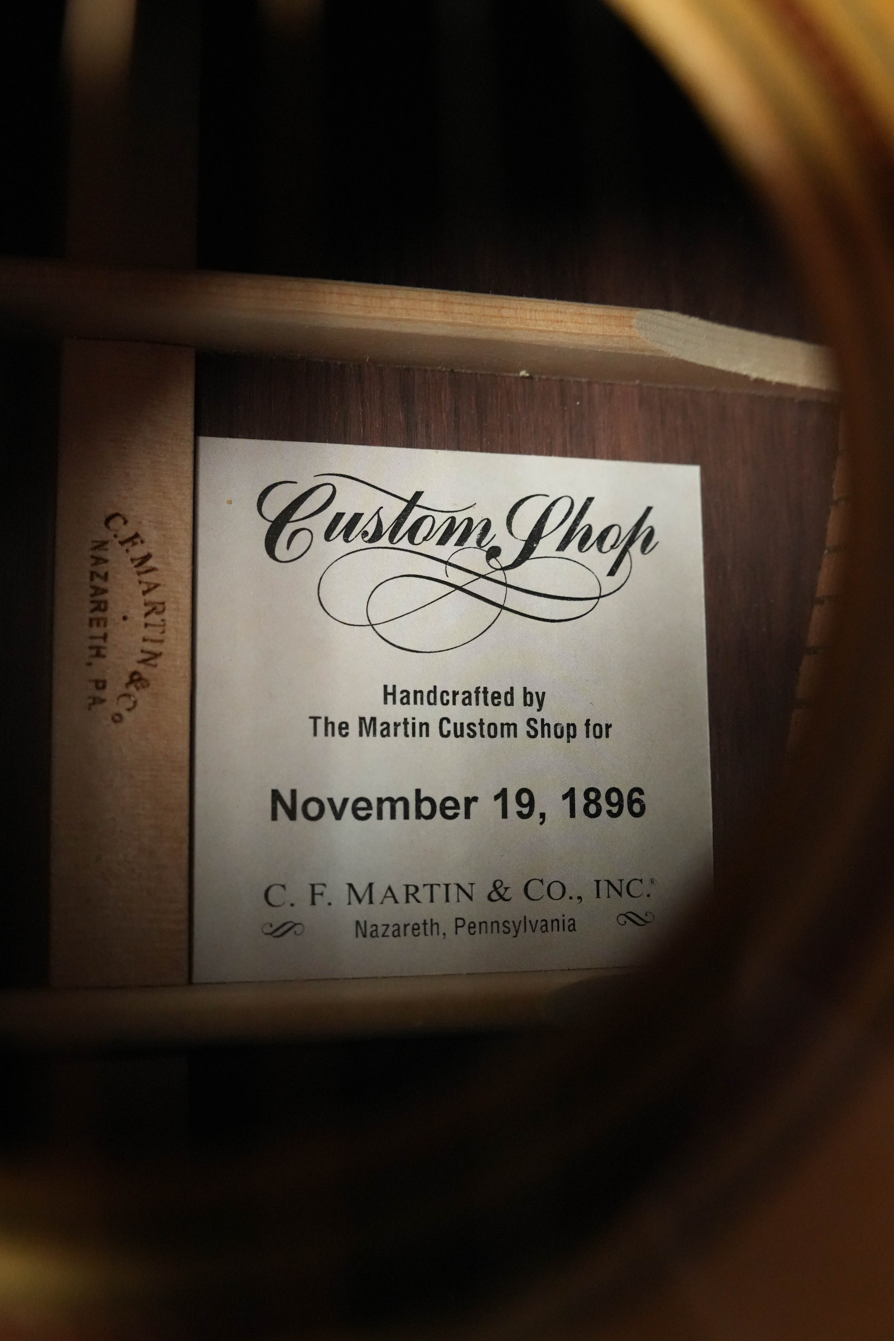 Close-up of the label inside the soundhole of a Martin & Co. Custom Shop Sitka/Rosewood Acoustic Guitar #6904, handcrafted in Nazareth, PA with fine VTS Sitka spruce and dated November 19, 1896.