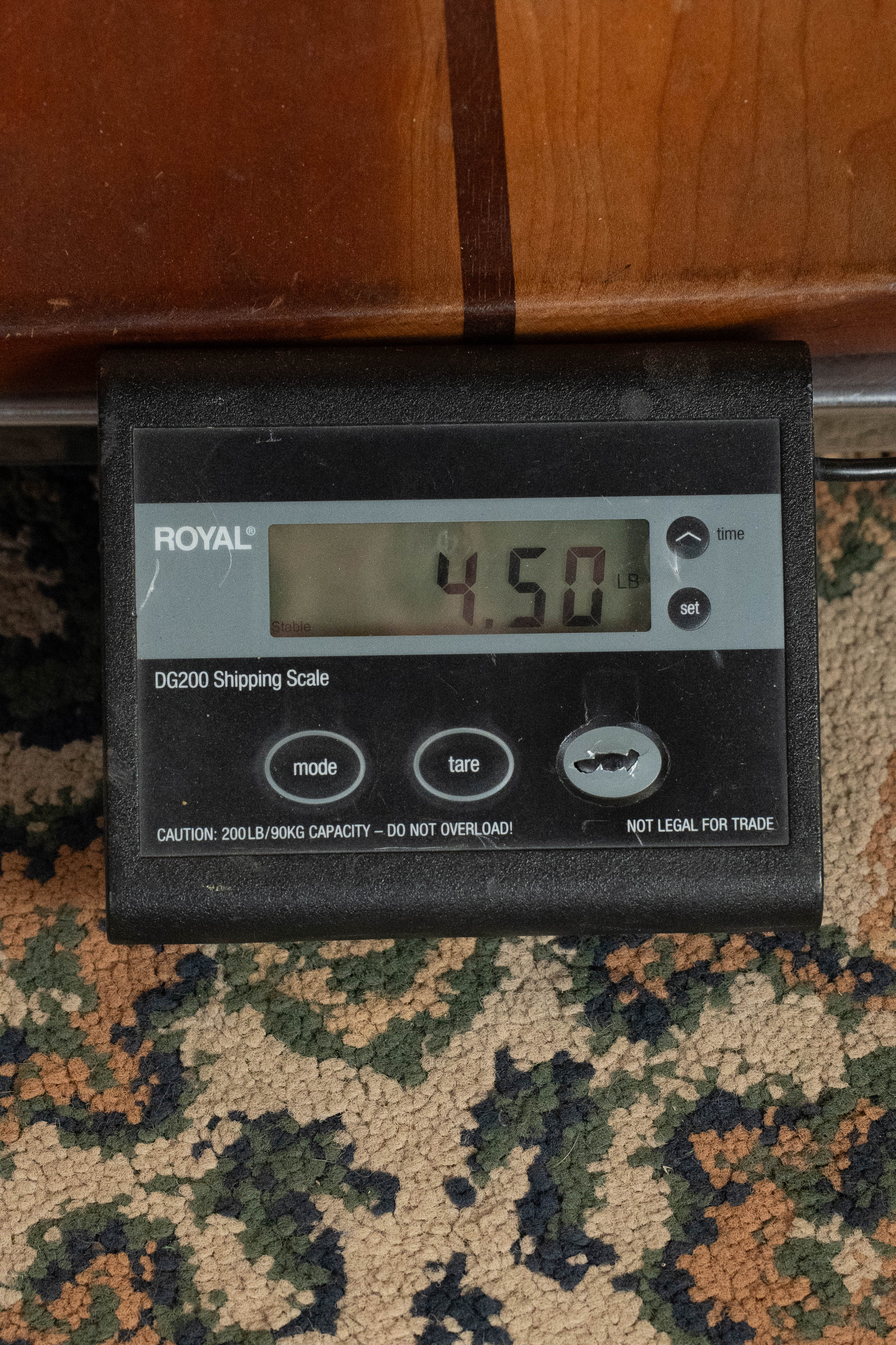A ROYAL DG200 Shipping Scale on a patterned carpet shows 4.50 lbs, reflecting the lightweight build of the Martin & Co. Custom Shop HD-28 Style Spruce/Wild Grain Rosewood "D" Dreadnought Acoustic Guitar #7410; scale not legal for trade.