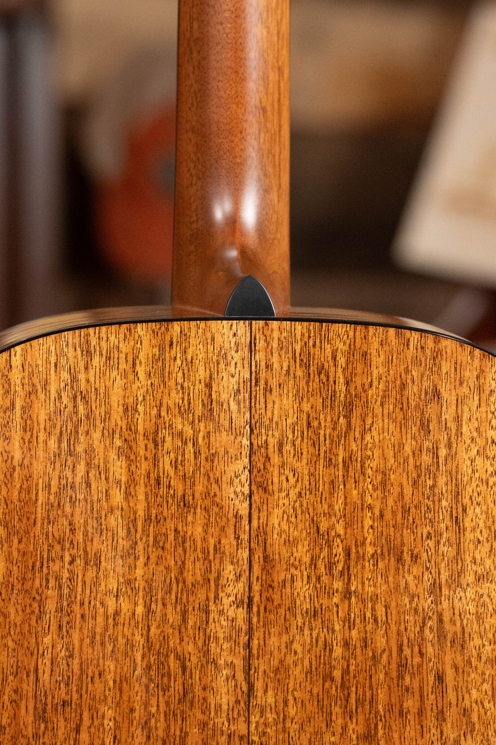Close-up of the neck joint and wood grain on the Martin & Co. Custom Shop D-18V Adirondack/Mahogany Dreadnought Acoustic Guitar #6905, showcasing its natural finish and expert craftsmanship.