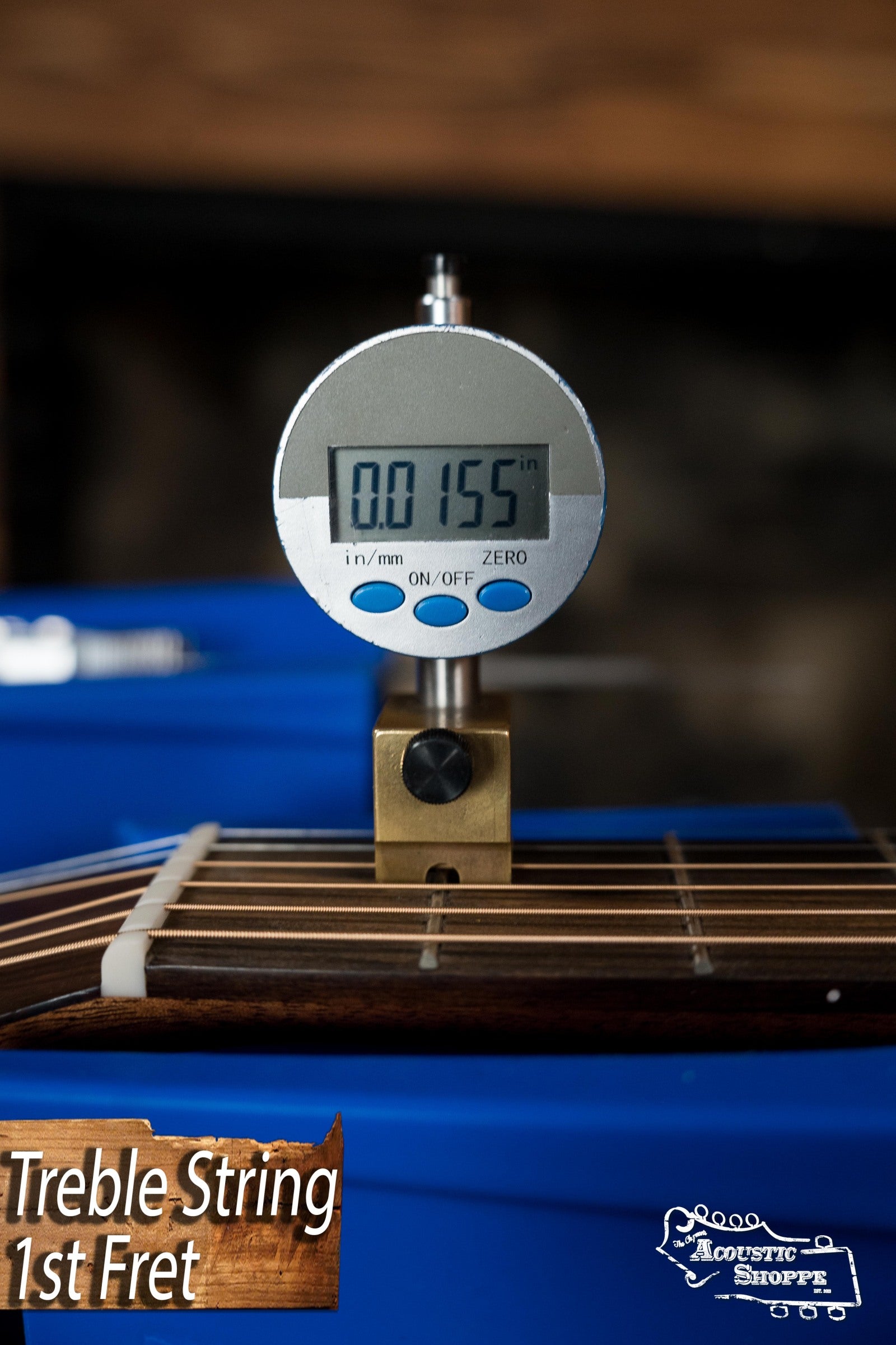 A digital gauge shows 0.0155" string height at the 1st fret of a Martin & Co. DE Retro Plus Torrefied Spruce/Mahogany Dreadnought Guitar w/Martin Electronics #0808. Text reads “Treble String 1st Fret” and “Acoustic Shoppe” with logo.