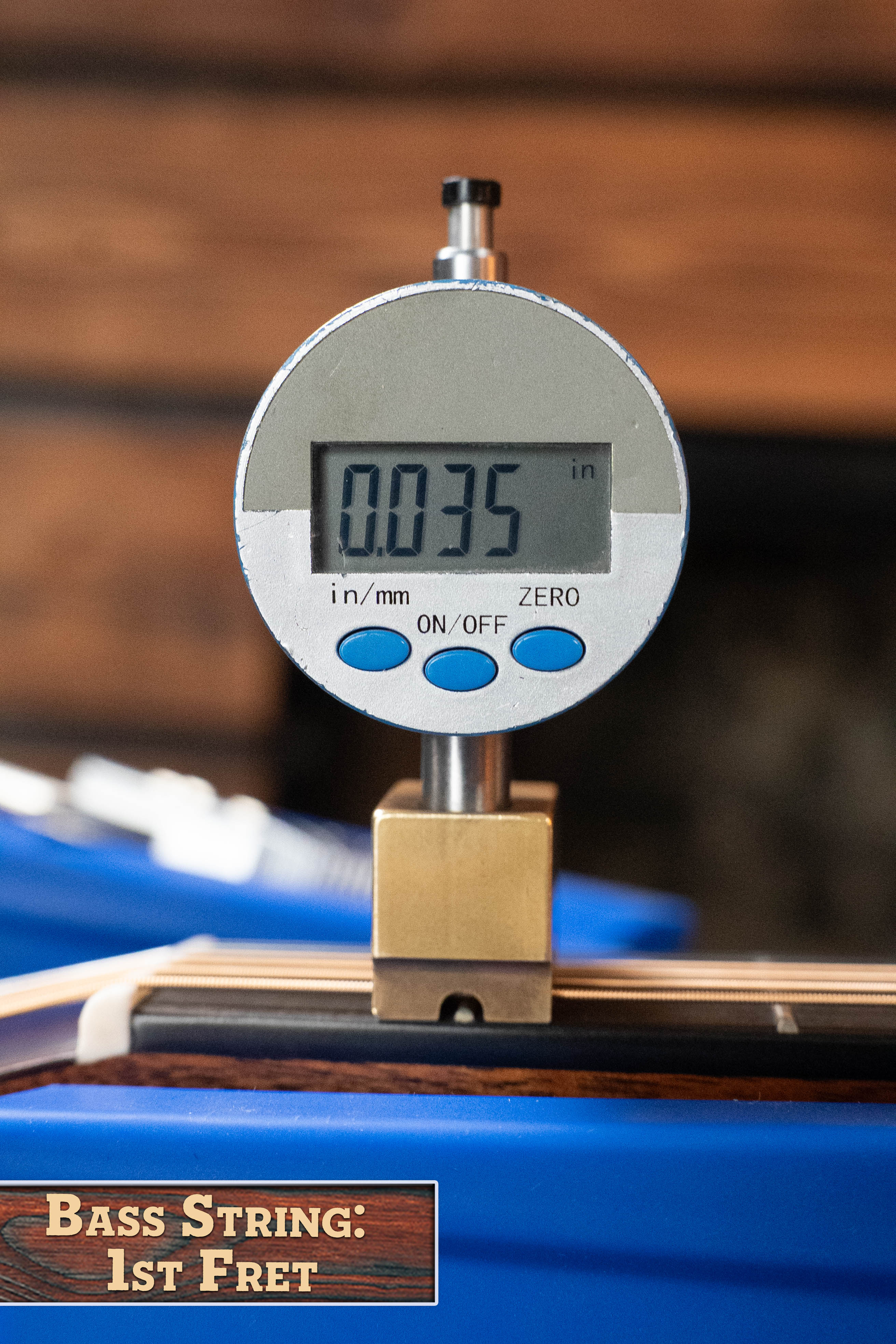 A digital gauge displays 0.035 inches above a bass string at the 1st fret, with a wood label below inspired by Martin & Co.’s *New 2025 Model* D-18 1933 Gloss Ambertone Spruce/Mahogany Dreadnought Acoustic Guitar #6784.
