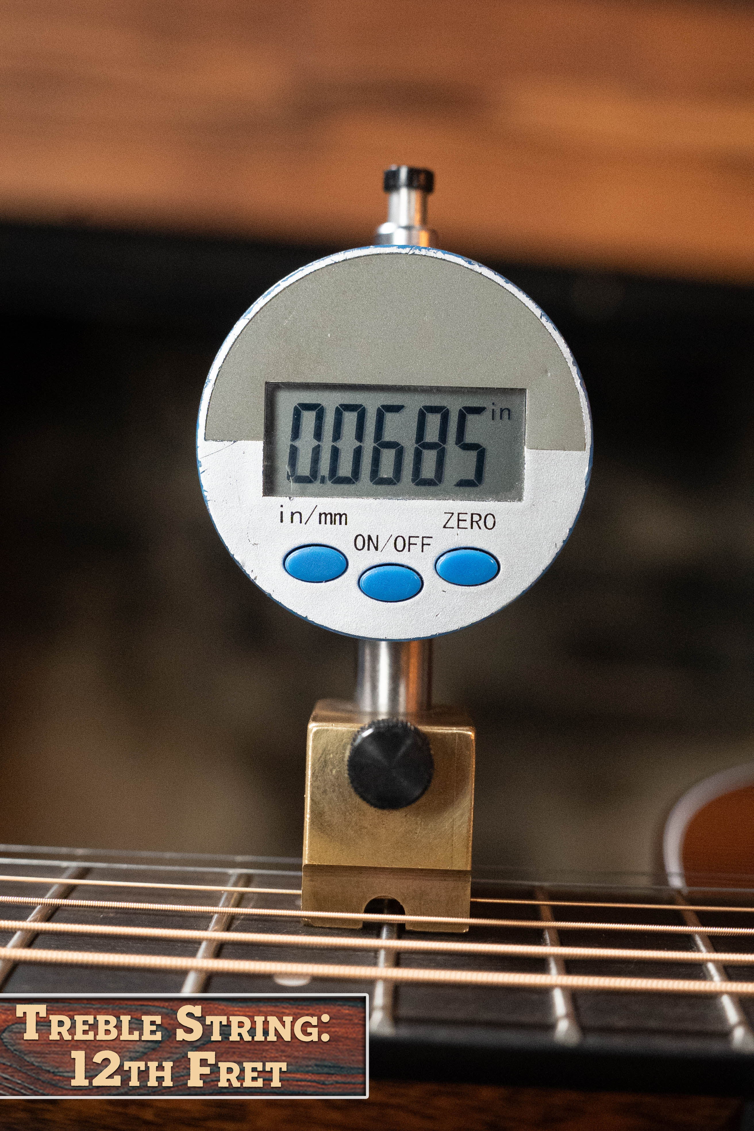 A digital gauge shows 0.0685 inches while measuring the treble string height at the 12th fret on a *New 2025 Model* Martin D-18 1933 Gloss Ambertone Spruce/Mahogany Dreadnought Acoustic Guitar #6784 by Martin & Co. The label reads Treble String: 12th Fret.
