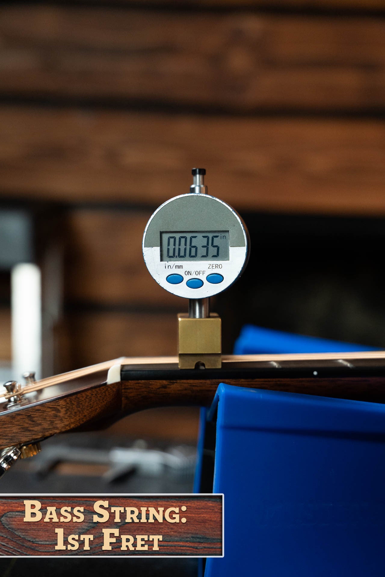 A digital gauge shows a 0.0635-inch bass string height at the 1st fret of this *New 2025 Model* Martin D-28 Gloss Spruce/Indian Rosewood Dreadnought by Martin & Co., with “Bass String: 1st Fret” displayed at the image’s bottom left.