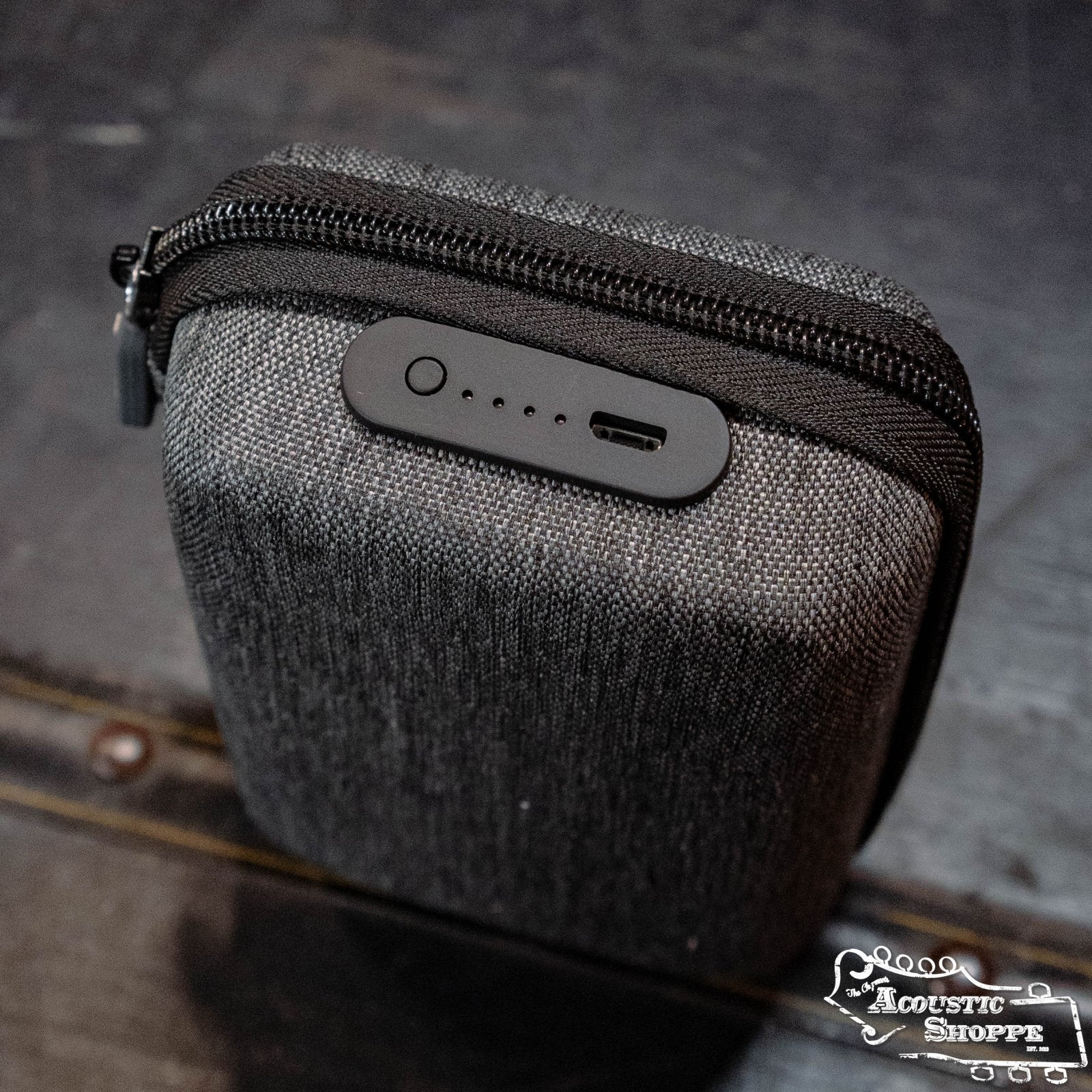 A gray, fabric zippered case designed for the NUX C-5RC 5.8GHz Wireless Guitar System (Black) features a USB port, four side LED indicators, and the Acoustic Shoppe logo in the bottom right corner.