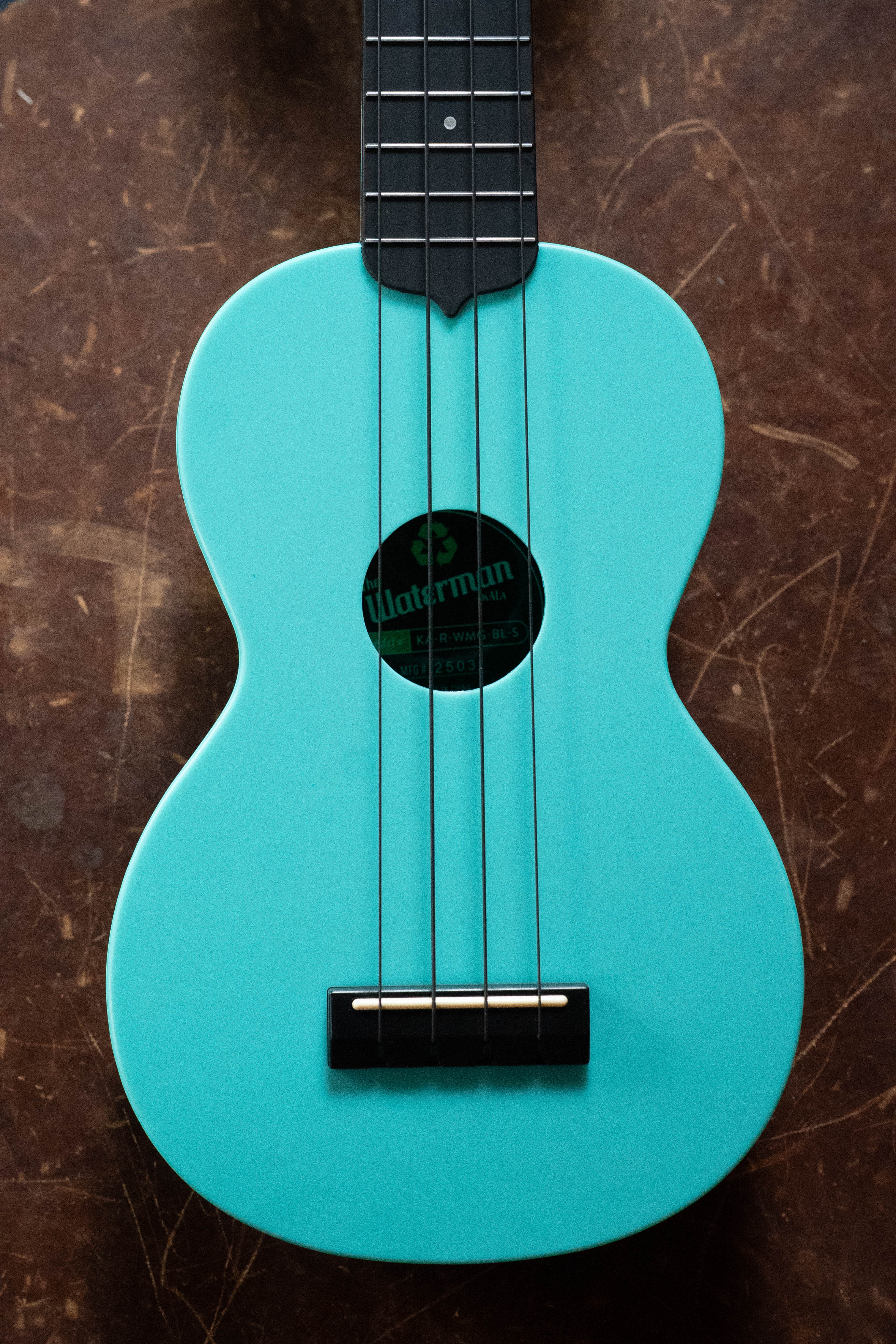 Aqua mist blue soprano ukulele with black fretboard and bridge, Kala Brand logo on soundhole label. - The Waterman Aqua Mist Glow-In-The-Dark Soprano Recycled Ukulele - Kala Brand - Default Title