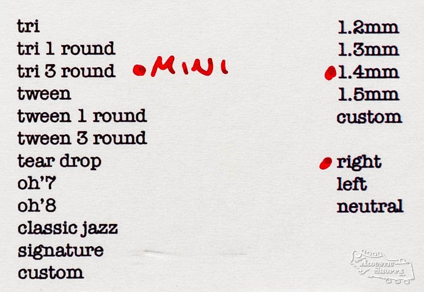A printed guide of ToneSlabs guitar pick shapes and sizes, featuring the Mini Tri 3Round Guitar Pick - 1.4mm highlighted in red, plus other acoustic options with all ToneSlabs shapes and thicknesses listed in millimeters.