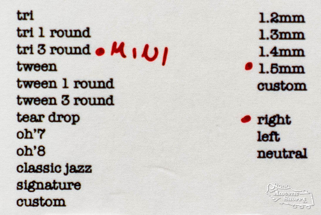 A printed list of ToneSlabs pick options shows the Mini Tri 3Round Guitar Pick - 1.5mm circled in red with “right” and “MINI” handwritten, plus Acoustic Shoppe’s ToneSlabs measurements for different pick styles.