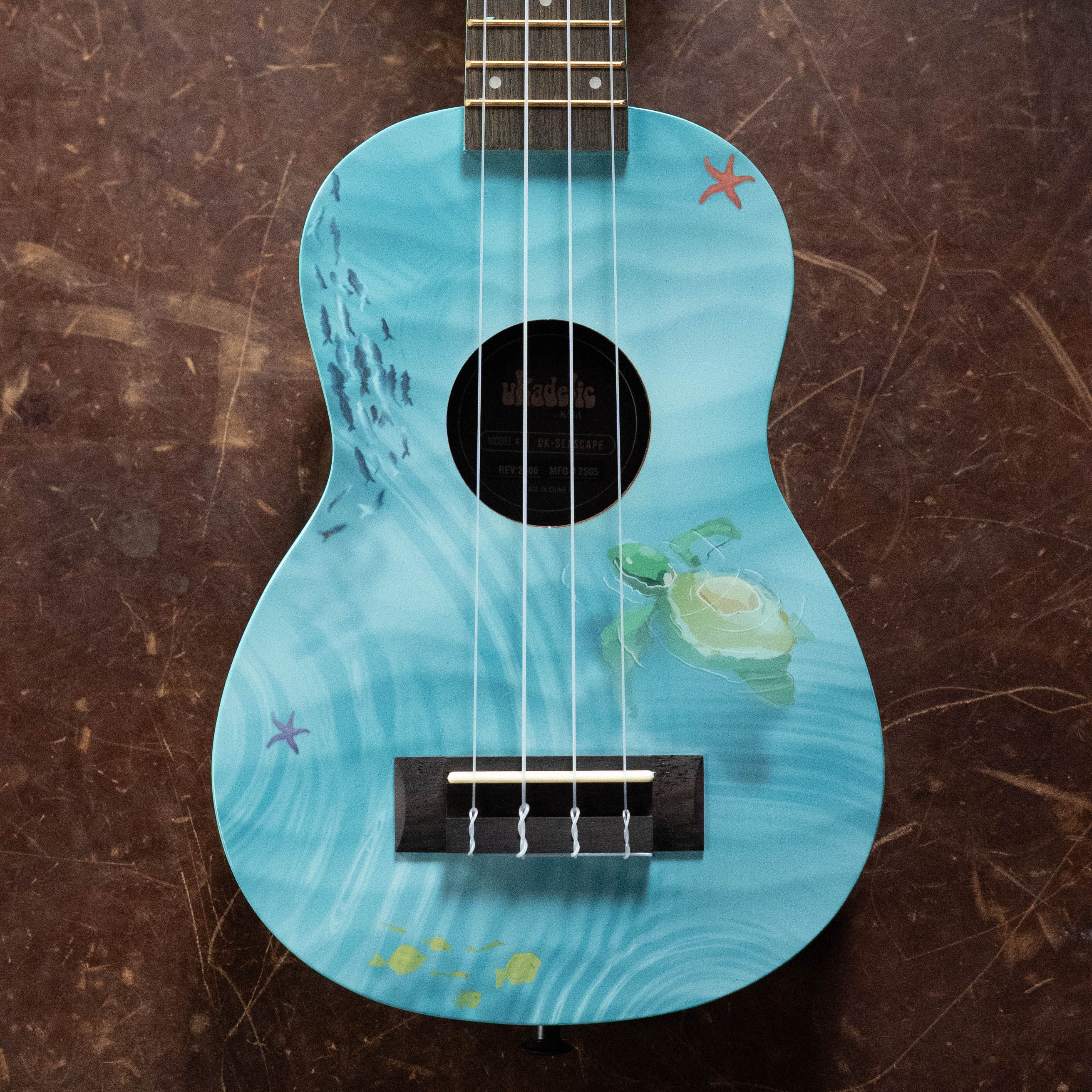 Soprano ukulele with blue seascape design featuring a sea turtle and starfish on the body. - Ukadelic Seascape Soprano Ukulele - Kala Brand - Default Title