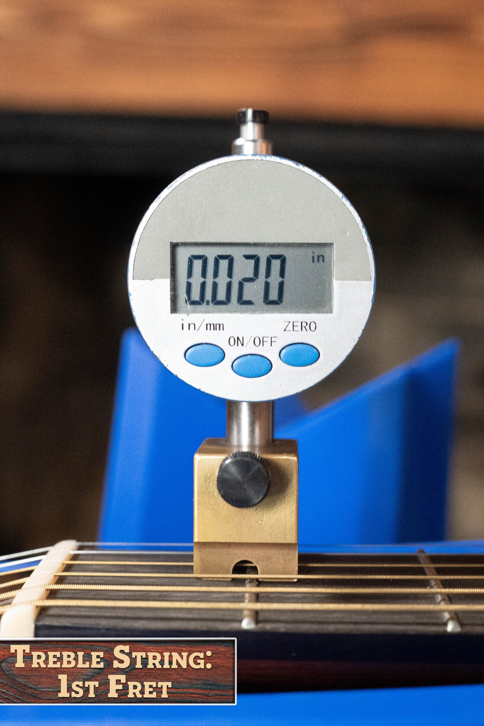 A digital gauge displays 0.020 inches while checking the treble string height at the 1st fret of a (Used) 2022 Martin Brook Ligertwood 000-28 Spruce/Rosewood OOO Acoustic Guitar by Martin & Co. Label: TREBLE STRING: 1st FRET.