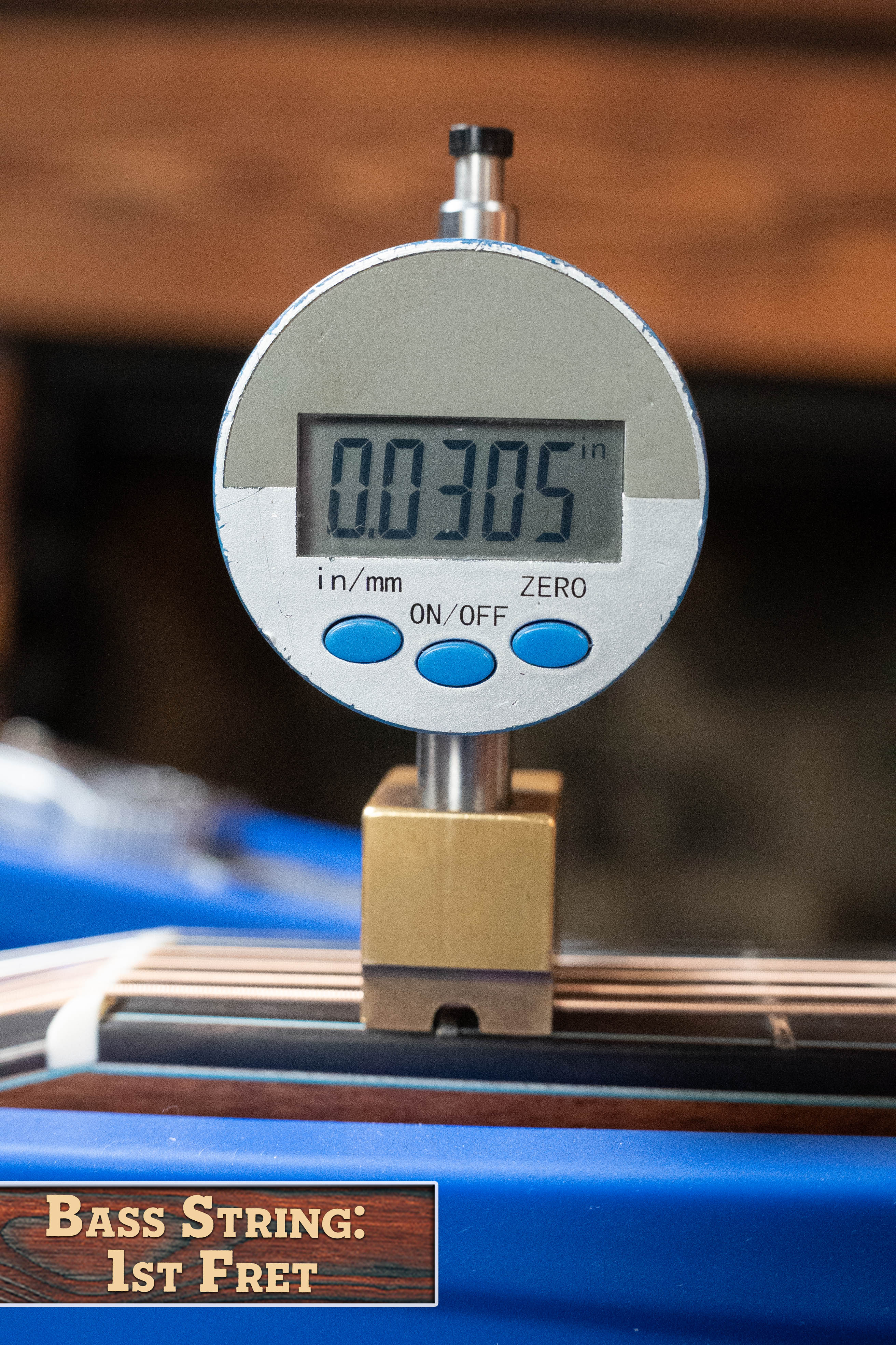 Bass String: 1st Fret — The digital caliper reads 0.0305" for the bass string height above the 1st fret on a (Used) 2025 Eastman L-OOSS-LTD-KOA Limited Edition Luthier Series All Koa Acoustic Guitar #9075 by Eastman Guitars.
