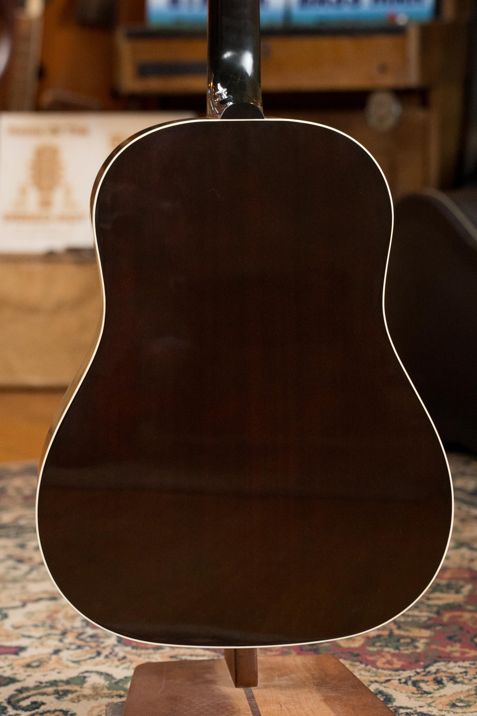 A close-up of a used Gibson J45 Standard Sitka/Mahogany Round Shoulder Dreadnought Guitar in Vintage Sunburst with K&K pickup (#4111).