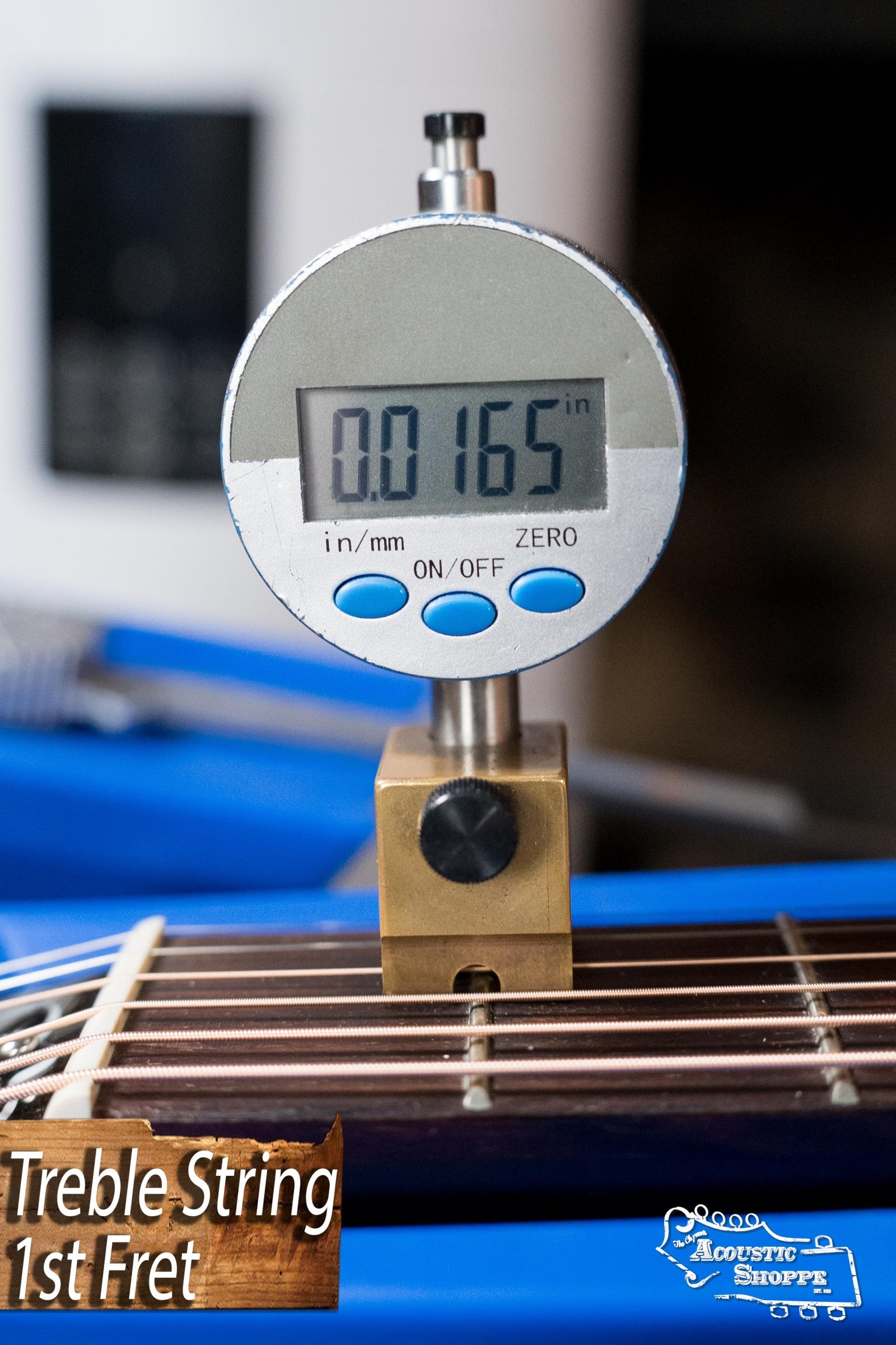 A digital gauge shows a 0.0165-inch string height at the 1st fret on a (Used) Gibson J45 Standard Sitka/Mahogany Round Shoulder Vintage Sunburst Dreadnought Guitar w/K&K Pickup #4111. Treble String 1st Fret and Acoustic Shoppe text are visible.