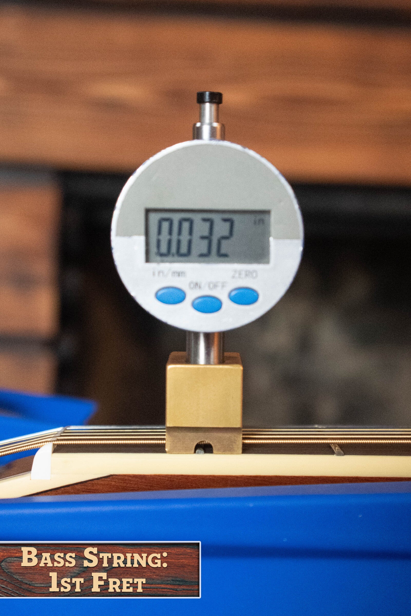 A digital gauge shows 0.032 above the first fret of a Yamaha FG830 Spruce/Laminate Rosewood Natural Dreadnought Acoustic Guitar #0562 string, indicating its height. A label reads: Yamaha Acoustic Guitar: 1st Fret.