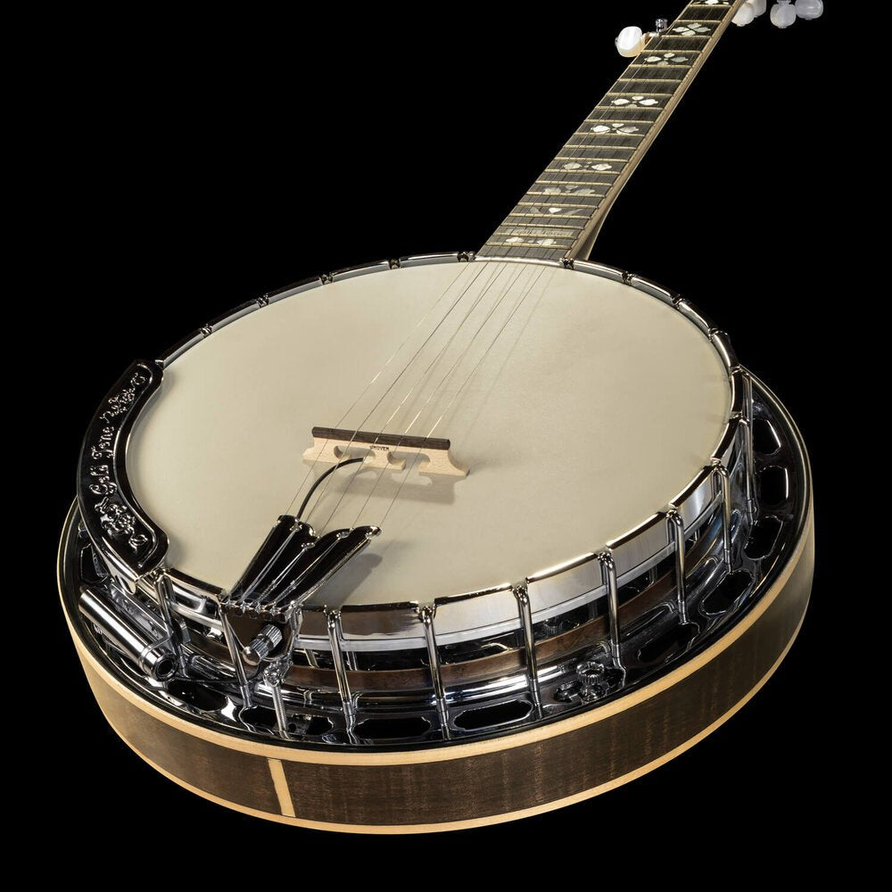 A close-up of a five-string banjo with a wooden body and shiny rim, featuring the L.R. Baggs Banjo Pickup 5/8 discreetly installed, photographed against a black background.