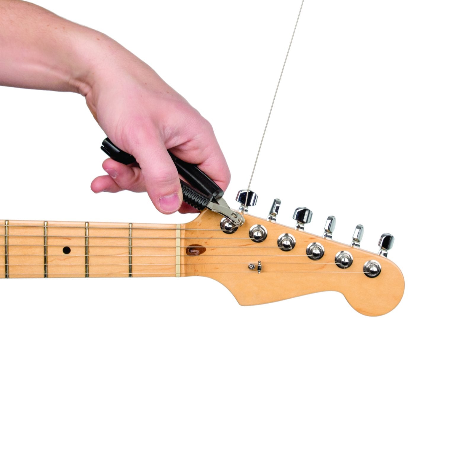 A hand uses the D'Addario Pro-Winder String Winder and Cutter - Black to trim a guitar string on the headstock of an electric guitar during restringing.