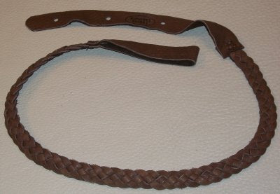 The Lakota FCH Flat Braid Mandolin Chocolate by The Acoustic Shoppe is a flat braided leather strap with holes and an attached loop, displayed on a light textured surface.