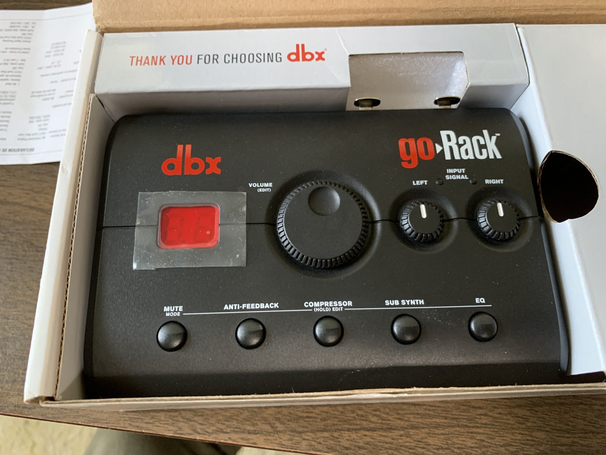 The image shows a (Mint) DBX goRack Performance Processor by DBX in its box, featuring knobs for volume, compressor, sub synth, EQ, anti-feedback, buttons, and a digital display—perfect for any PA system.