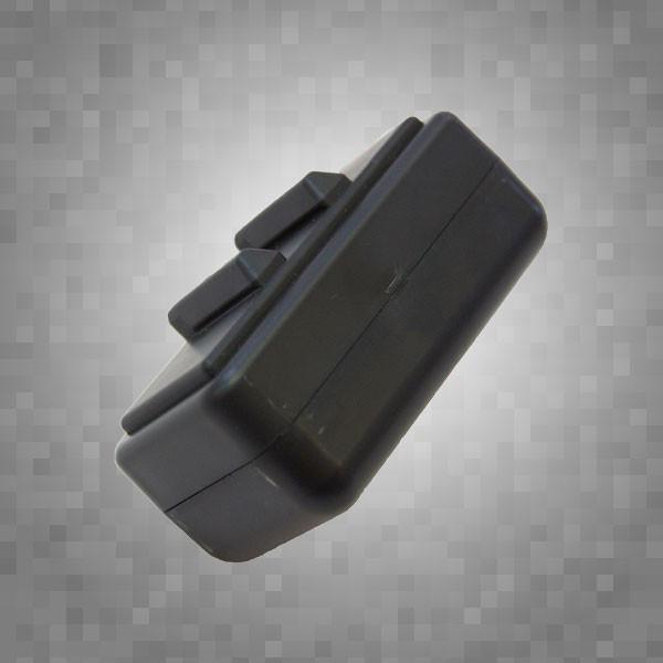 The Acoustic Shoppe’s ToneRite Mandolin is a black rectangular device with two buttons on top, designed to enhance vintage mandolin sound, pictured against a gray pixelated background.