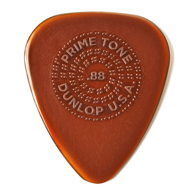 The Dunlop Primetone 510P Standard Teardrop Pick w/Grip (3 Pack) is a brown guitar pick with embossed text, offering a great alternative to tortoiseshell picks. Select your preferred gauge for optimal playability.