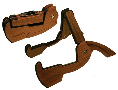Two Cooperstand Pro-G Instrument Stands by Cooperstand, crafted from African Sapele hardwood, are displayed—one folded and one open—both featuring curved bases and black rubber padding for secure instrument support.