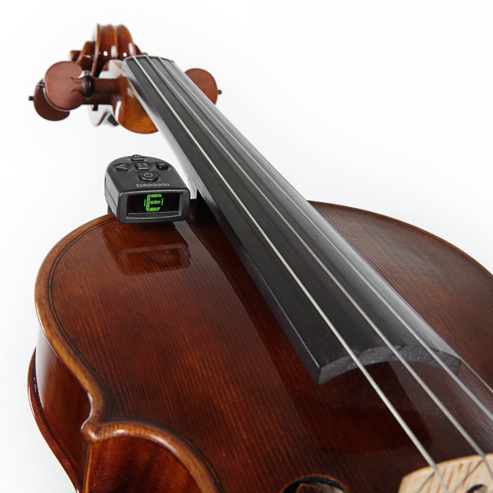 Close-up of a D'Addario PW-CT-14 Micro Violin Tuner attached to a violin’s body near the fingerboard, viewed from the bridge up the neck, against a white background.