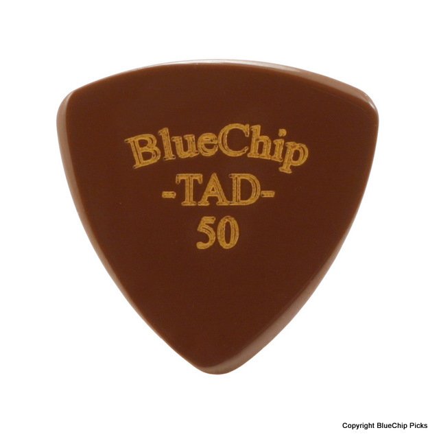 A brown, triangular BlueChip Picks (TAD50) guitar pick with rounded edges, featuring “BlueChip Picks -TAD- 50” in gold on the front—ideal for acoustic accessories.
