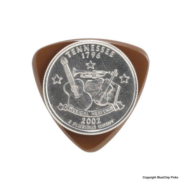 A Tennessee state quarter with musical instruments rests on a BlueChip Picks (TP50) triangular pick by BlueChip, its design and text clear—a perfect nod to acoustic music tradition.
